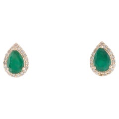 14K Yellow Gold Emerald 
Diamond Stud Earrings Featuring 1.10 Carat Pear Modifi