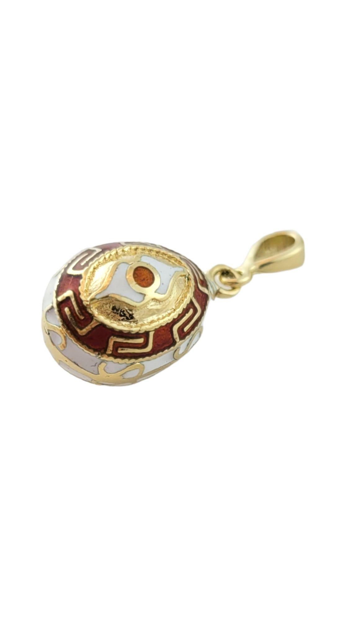 This adorable 14K yellow gold egg charm is decorated in gorgeous patterns using orange and white enamel!

Size: 17.3mm X 10.7mm X 10.7mm

Length w/ bail: 24.9mm

Weight: 3.4 g/ 2.1 dwt

Hallmark: S&M 14K

Very good condition, professionally