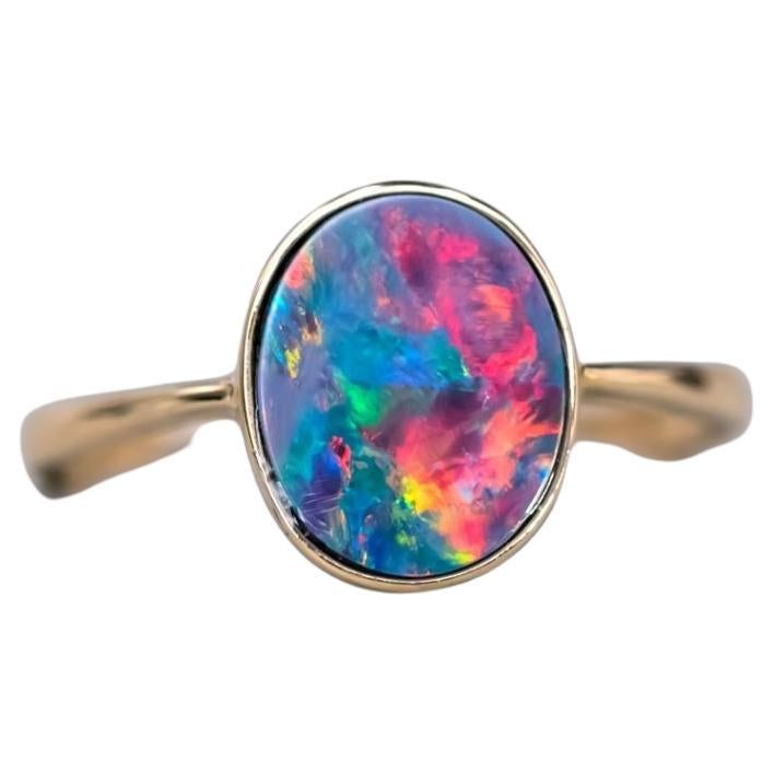 14K Yellow Gold Engagement Ring featuring an Oval Australian Doublet Opal