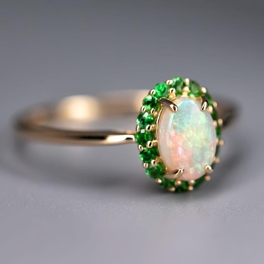 14K Yellow Gold Engagement Ring featuring Australian Crystal Opal Halo Tsavorite.


Free Domestic USPS First Class Shipping! Free Gift Bag or Box with every order!

Opal—the queen of gemstones, is one of the most beautiful gemstones in the world.