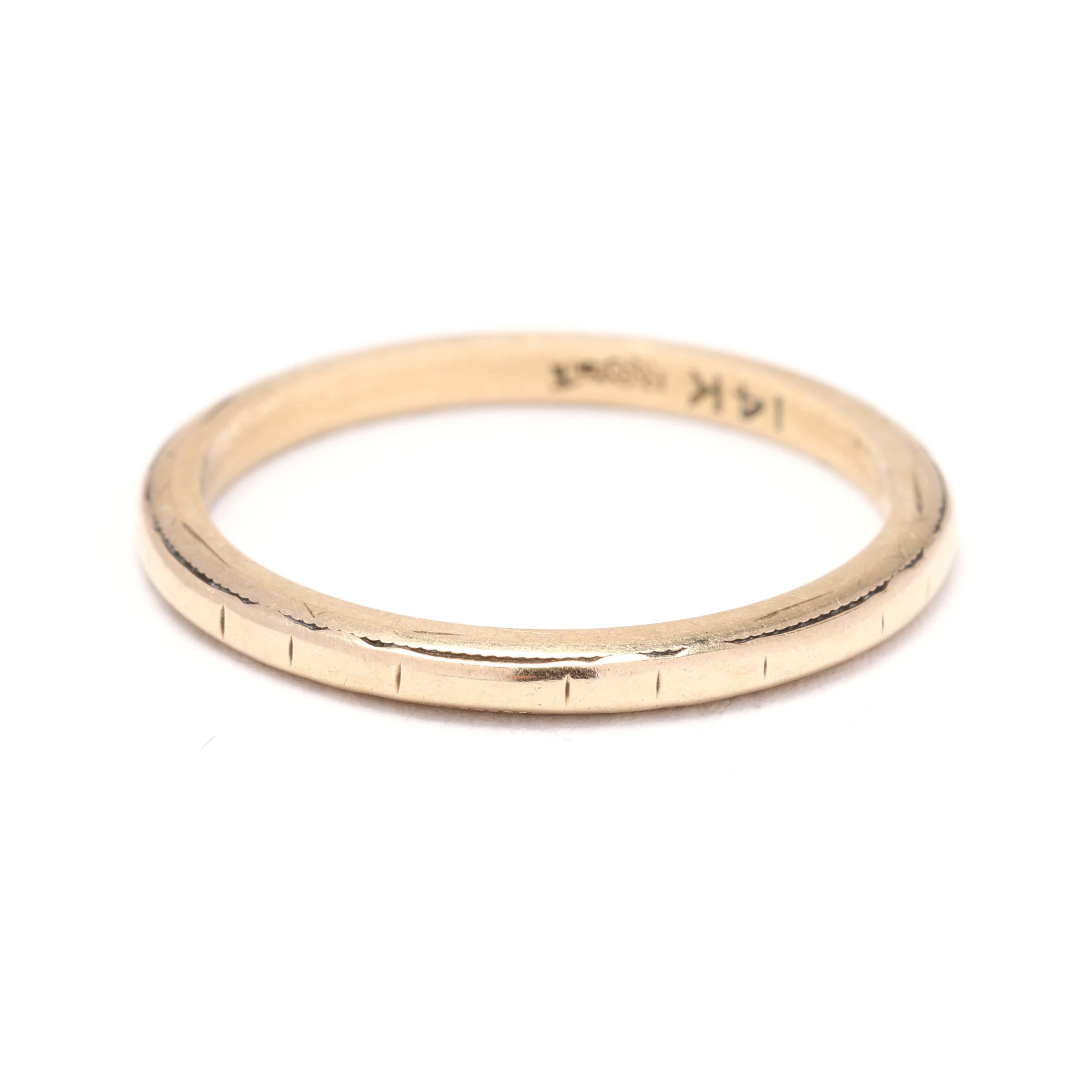 This 14K Yellow Gold Engraved Ring is a beautiful and timeless piece of jewelry that can be worn on its own or stacked with other rings. The ring is made of high-quality 14K yellow gold, ensuring durability and long-lasting shine. The band is