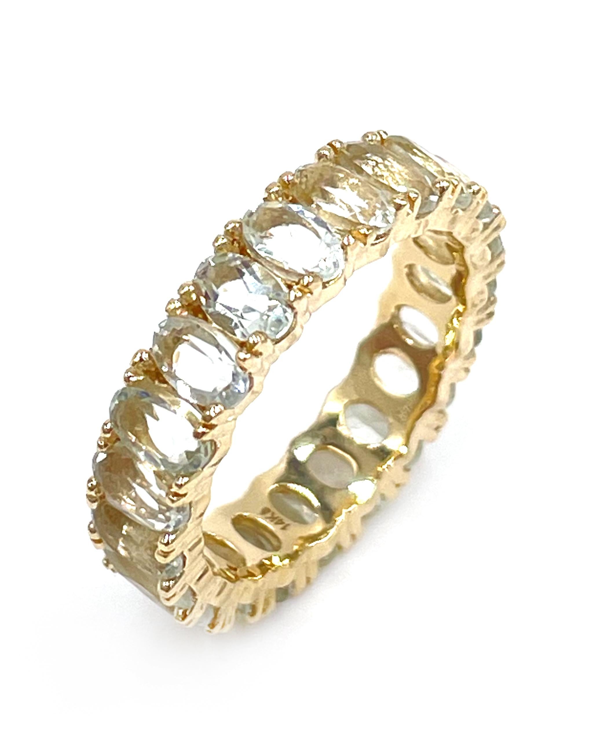 14K yellow gold eternity band with 20 faceted oval green amethysts weighing 4.98 carats total.

* Approximately 5mm wide