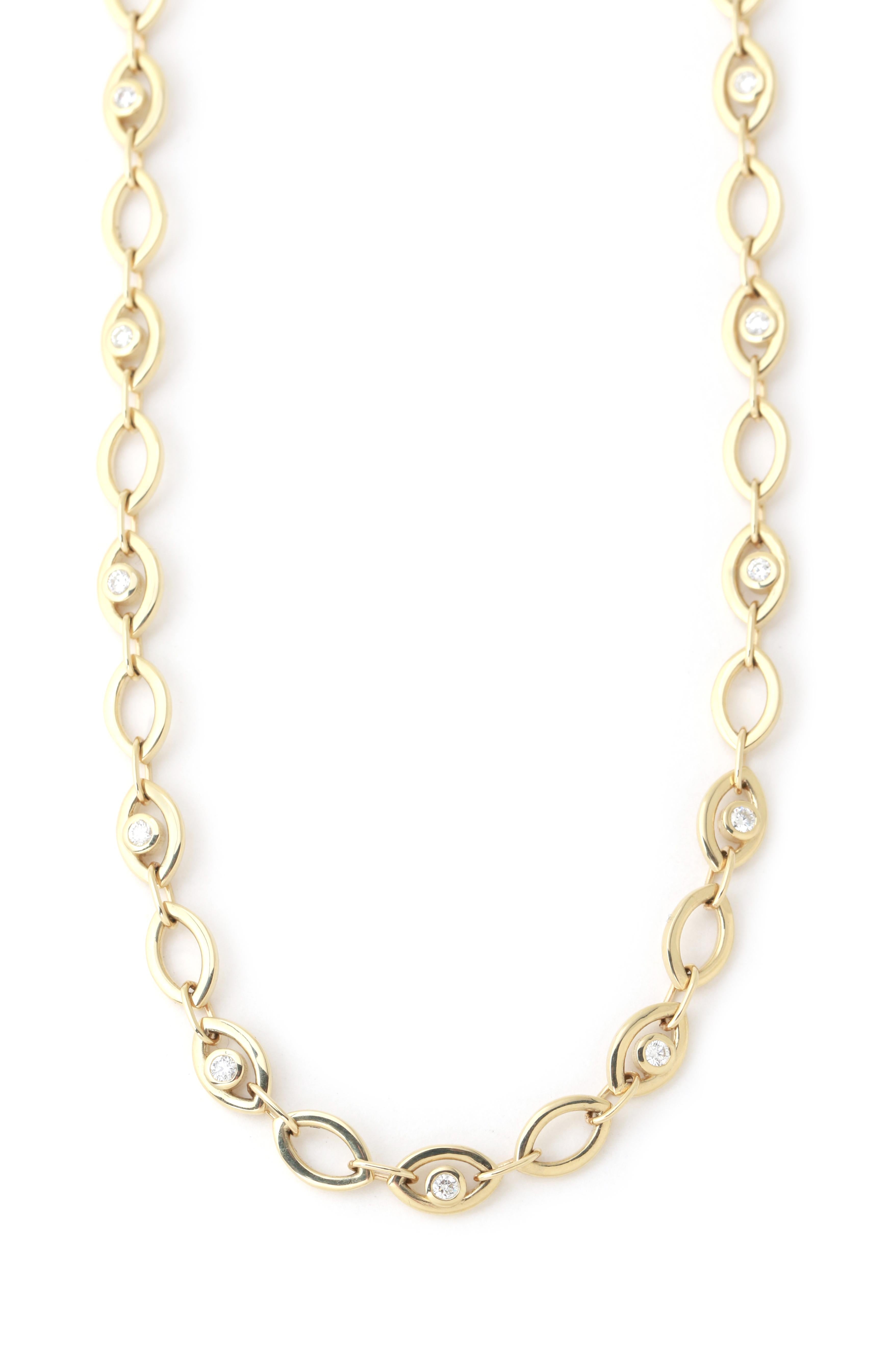 Repeating links of white diamond eye pieces connect to form and chain necklace that extends a total length of 16 inches.

14k yellow gold
white diamonds, 0.77 carats total