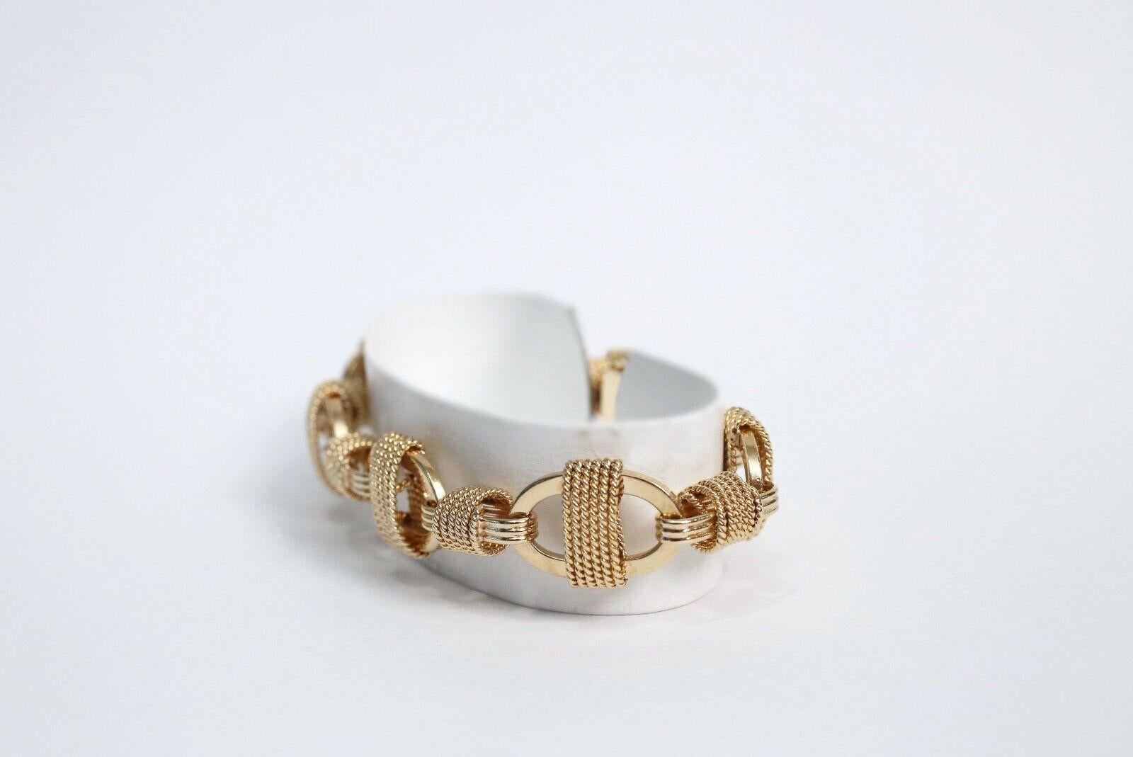 Elevate your wardrobe with this stunning oval link bracelet. Unique in design this lovely bracelet is meticulously crafted in solid 14k yellow gold. The links are designed with a fancier mariner link style than most typical mariner links. Smooth