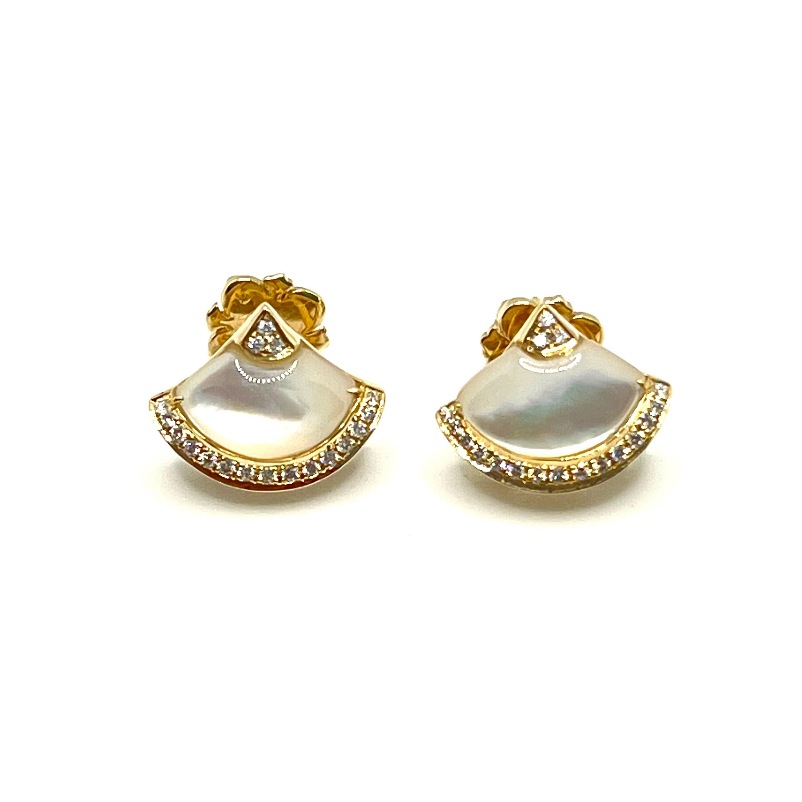 Stunning handcrafted fan-shape mother of pearl diamond stud earrings.

Handcrafted from 14k yellow gold, the earrings features beautiful 2.7 carats Mother of Pearl and .17 carats of diamonds! Straight post with large friction earrings back allow the