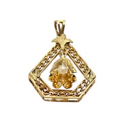 Pendentif en or jaune 14 carats avec cadre en forme de fleur en filigrane #25757
