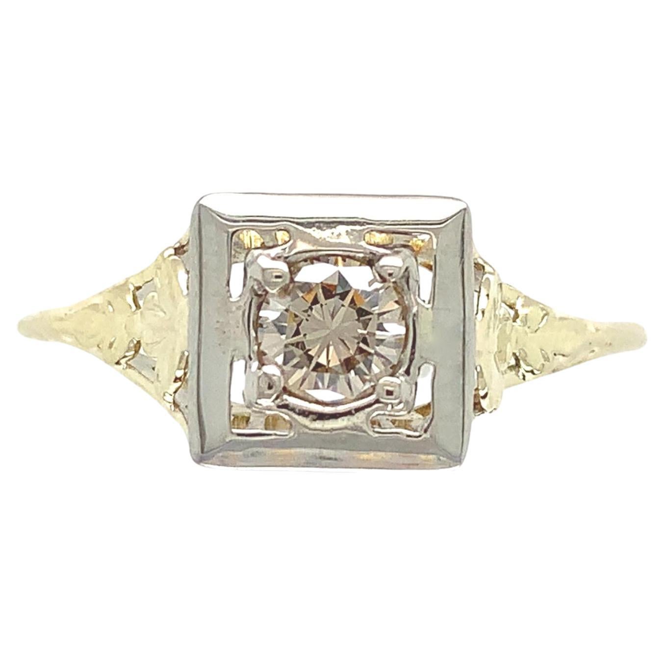 14K yellow gold filigree ring with a white gold top featuring a round brilliant For Sale