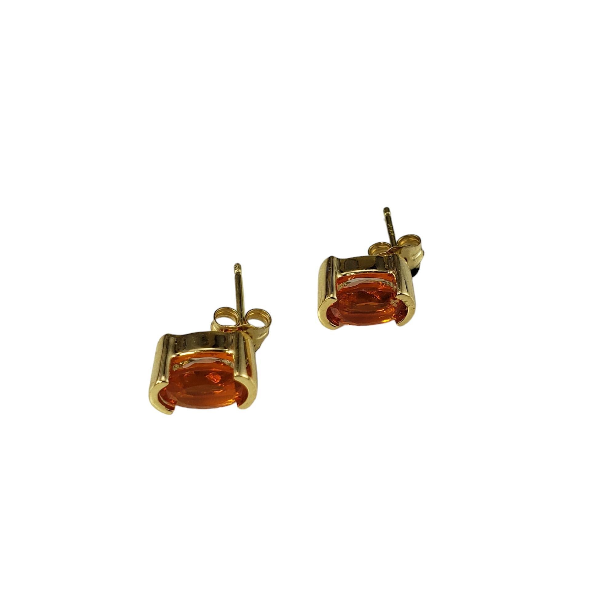 14K Yellow Gold Fire Opal Stud Earrings JAGi Certified-

These elegant stud earrings each feature one oval fire opal (7.3 mm x 5.0 mm) set in beautifully detailed 14K yellow gold.  Push back closures.

Total opal weight: 1.22 ct.

Size:  9 mm x 5
