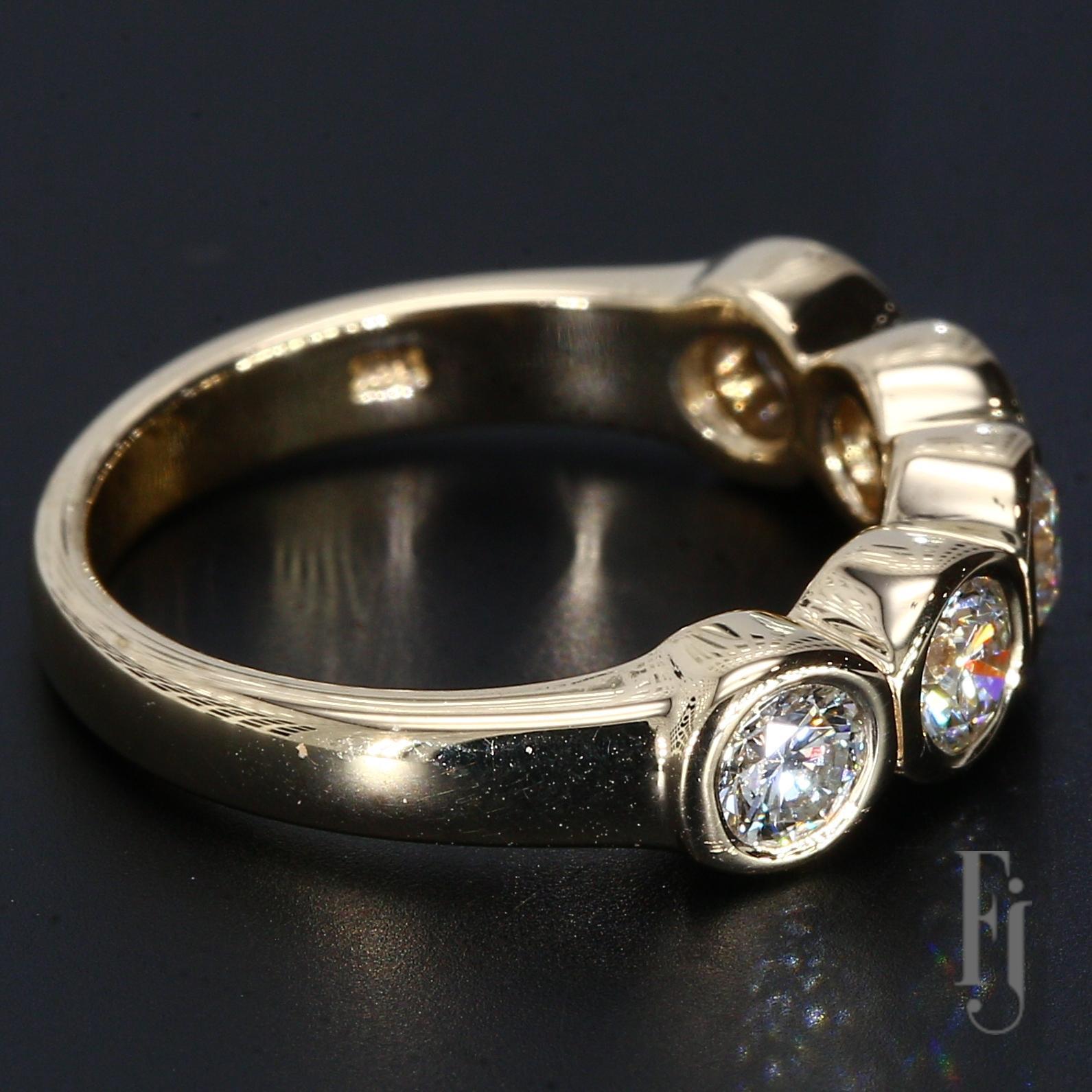 A 14k Yellow Gold Ring with Five Bezel Set Diamonds Each Weighing ~0.25ct. The Diamonds are Graded VVS2/F.

Size - 5.25
Total Weight - 4.21g
A69