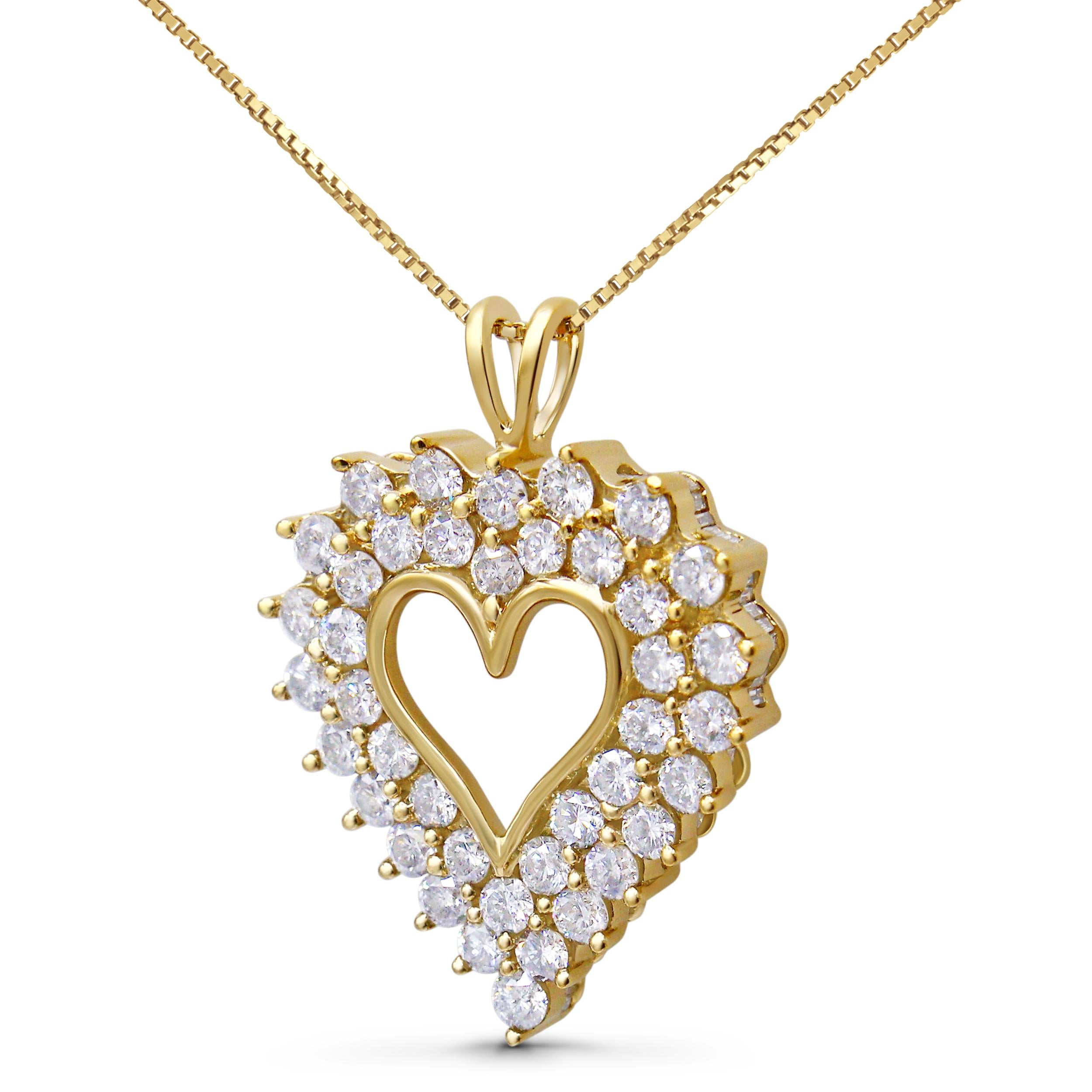 Enveloped in the warm embrace of 14K yellow gold plating, this .925 sterling silver heart pendant necklace is a symphony of love and radiance. At its heart lies a polished, heart-shaped outline, caressed by a double frame of twinkling 1/15 ct. round