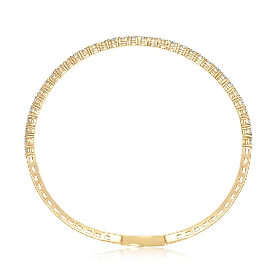 14K yellow flexible bangle with a double safety lock. The total carat weight of the bangle is 2.10. Each stone weighs approximately 0.07 carats. The color of the stones are G, the clarity is SI1-SI2. This bangle is sold individually or as a set