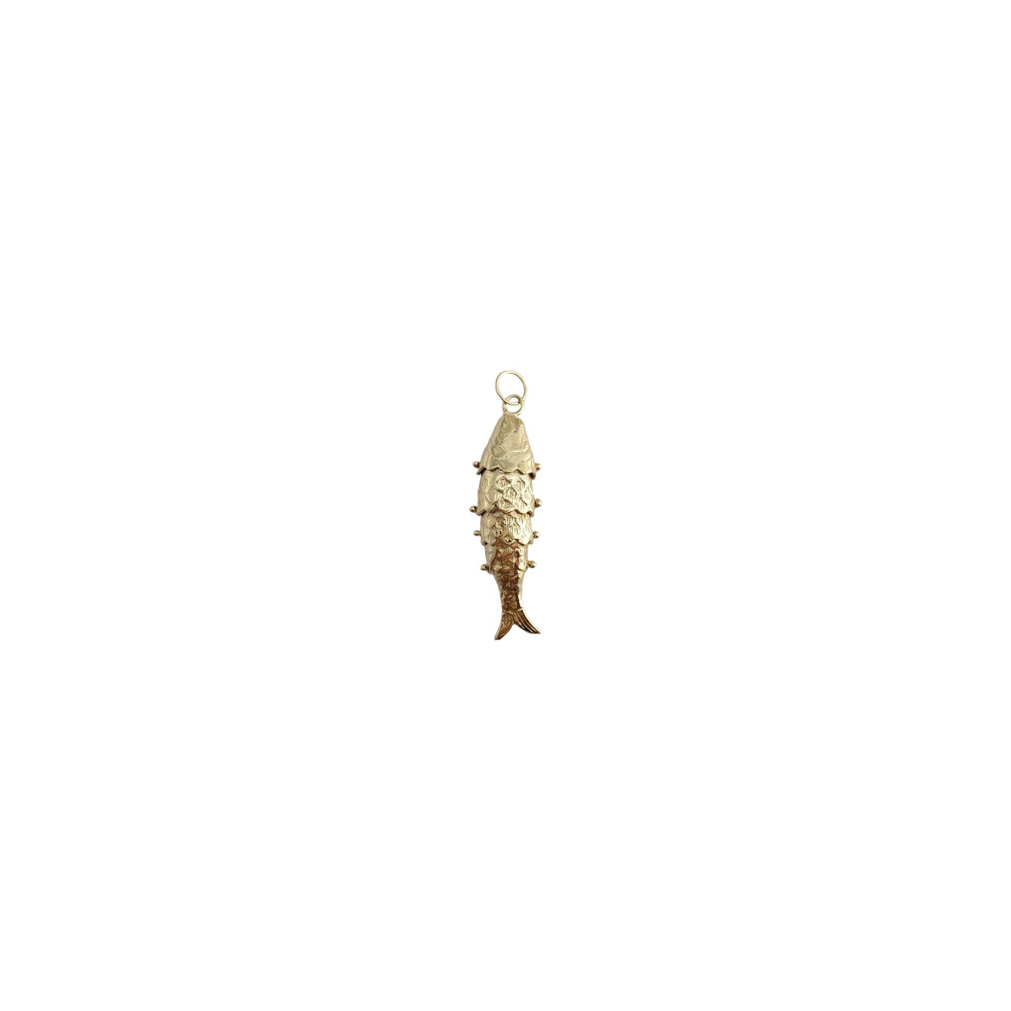14K Yellow Gold Flexible Fish Charm

This meticulously detailed piece features an articulating fish charm.

Size: 45.03 mm X 13.14 mm 

Weight: 6.7 gr/ 4.3 dwt.

Hallmark: 14K

Very good condition, professionally polished.

Will come packaged in a