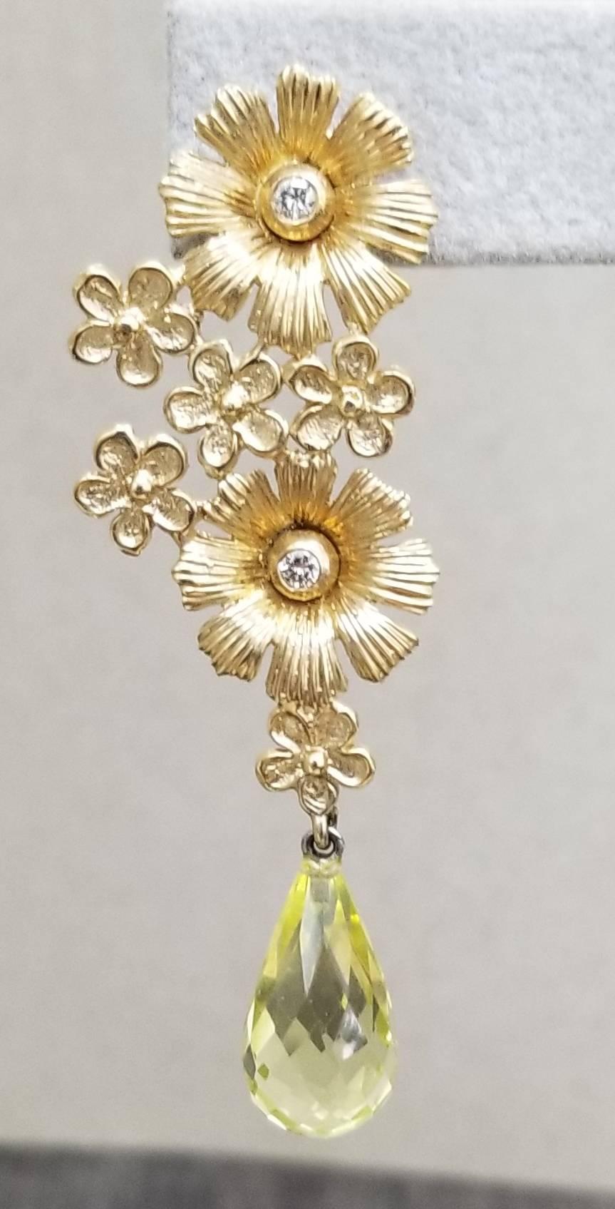 14k yellow gold flower and 4 diamonds weighing .28pts. and 2 citrine briolette cut drops weighing 15.25cts. as right and left earrings.
this design is ours and can be created in any other form; ring, necklace, bracelet, or earrings