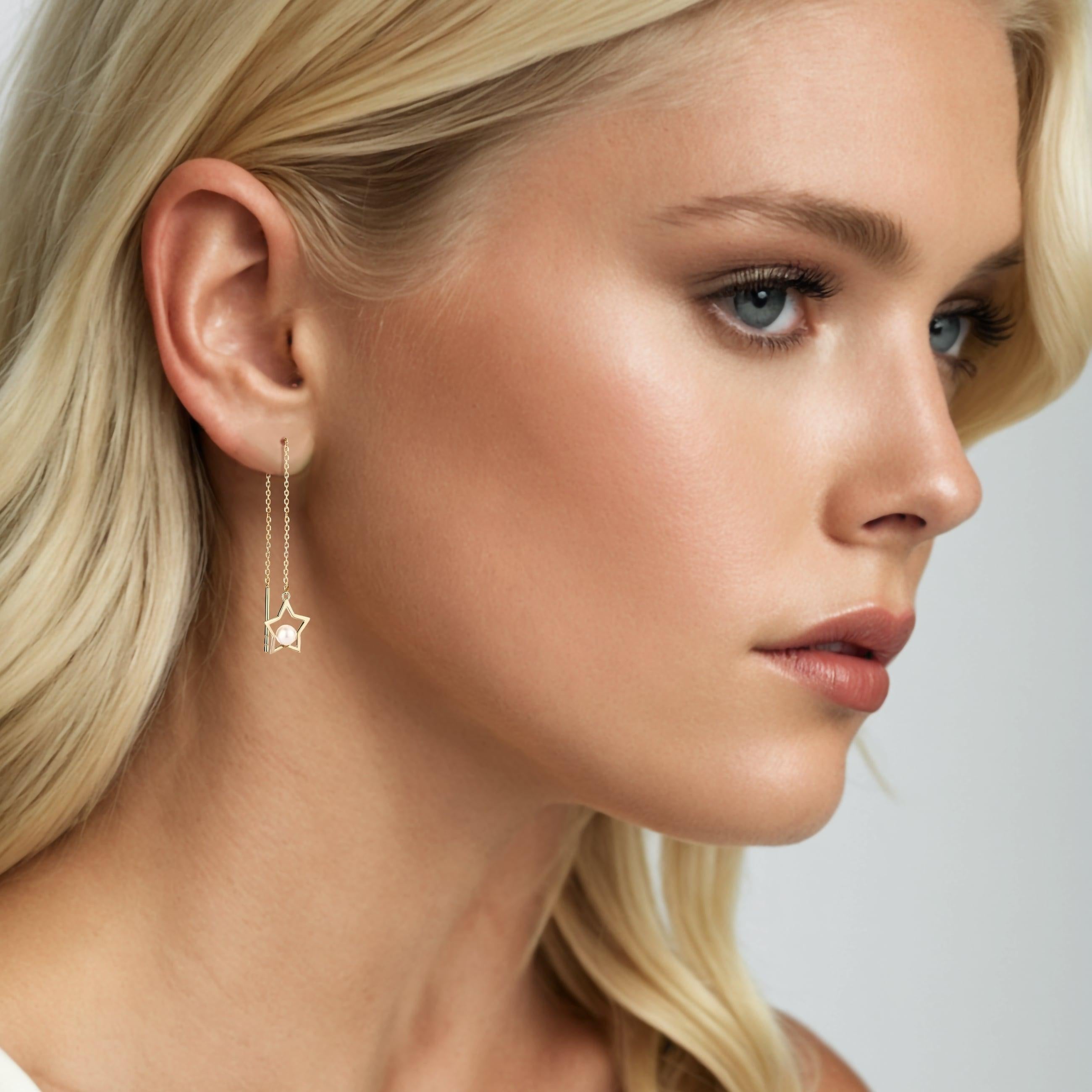 Elegant and timeless, these Open Star Freshwater Pearl 14K Yellow Gold Threader Earrings feature lustrous, natural pearls set in classic yellow gold. The soft glow of the freshwater pearls contrasts beautifully with the warm gold, creating a look of