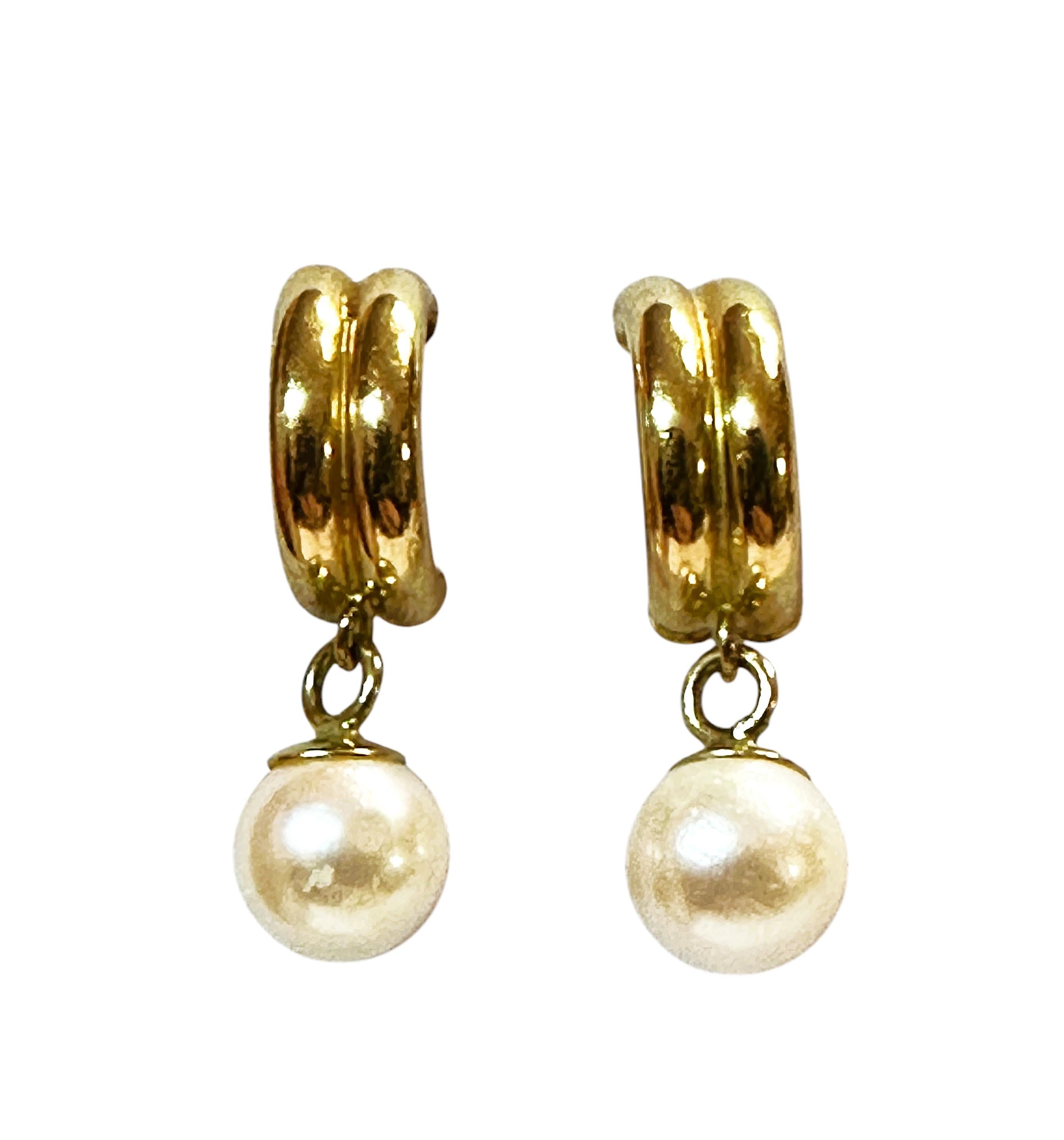 This is a classic pair of pearl earrings.  The pearls are 6 mm round.  The post of the earrings is marked 