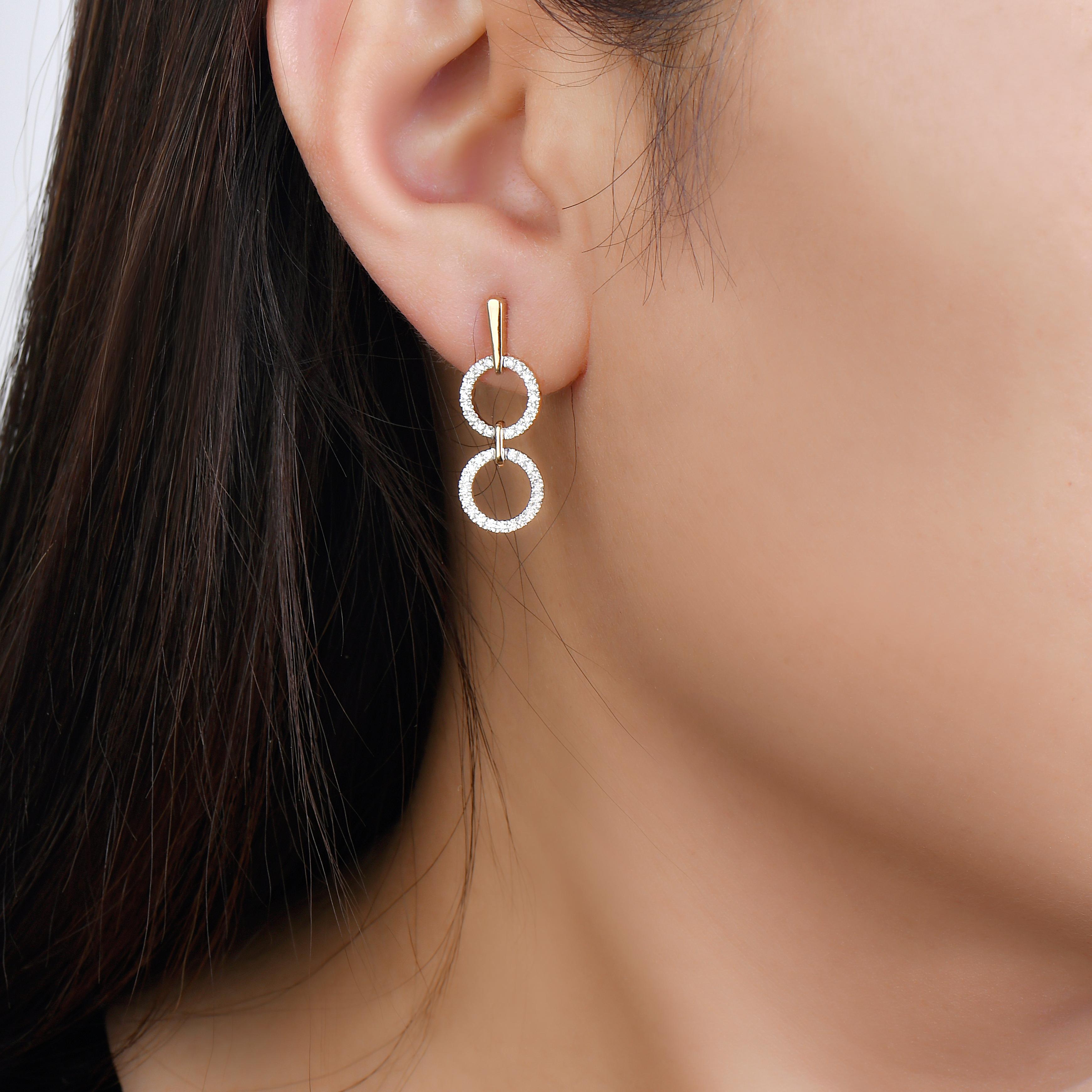 A different take on dangling earrings, these geo art earrings have more of a hang than a dangle. However, that does not make them any less stunning. The diamond dangling earrings in 14K white gold are perfect to gift someone you share a special
