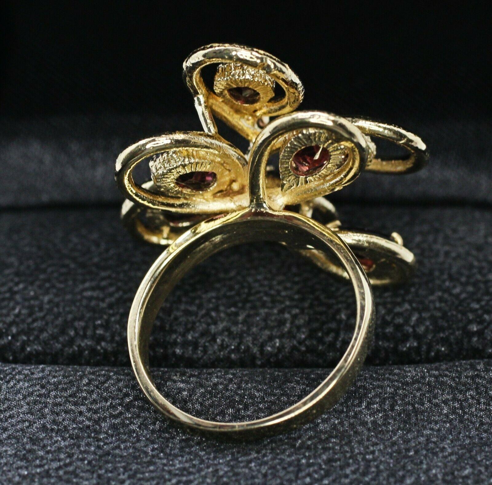  Product Details
    Metal: 14K YELLOW GOLD
    Measurements :
        Width/Lenght: 1'INCH EACH SIDES
        Thickness: 9.05 mm
Specifications:
    main stone: 7PCS PS GARNET APPROX 6.01MM-4.03mM
    additional: ROUND CUT DIAMOND
    diamonds: 1