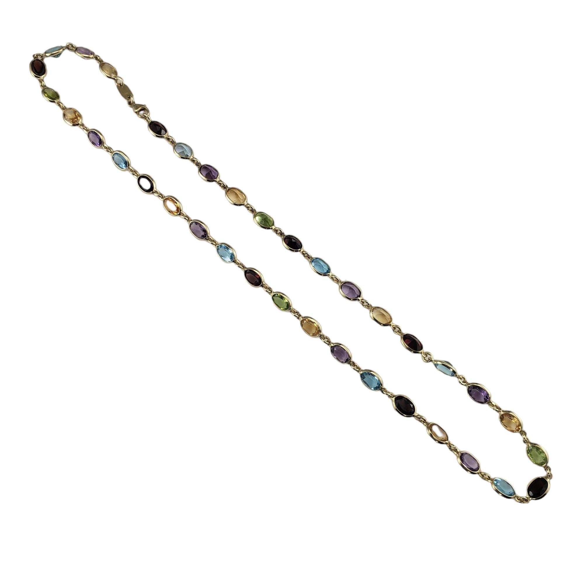 Vintage 14K Yellow Gold Gemstone Necklace Lab Certified-

This elegant necklace features eight blue topaz, eight garnets, citrines and amethysts and four peridots set in classic 14K yellow gold.  Width: 5 mm.

Total gemstone weight: 34.6 ct.

Size: