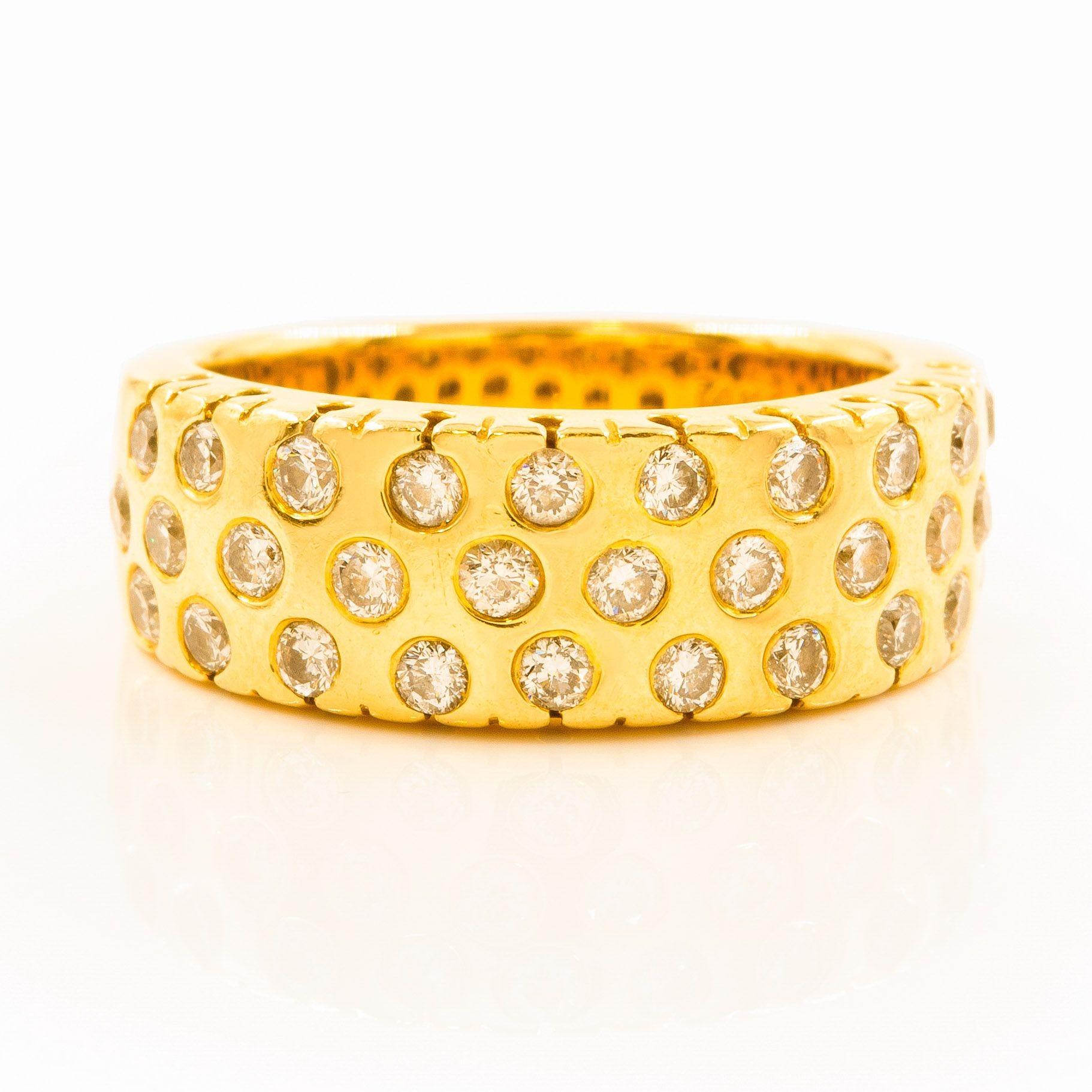 14K Yellow Gold & Gemstone Ring by Sonia Bitton, size 7
Item # C104618

A beautiful ring made of 14 karat yellow gold and studded with gemstones. The design is elegant with multiple stones set across the band, giving it a luxurious appearance. It's