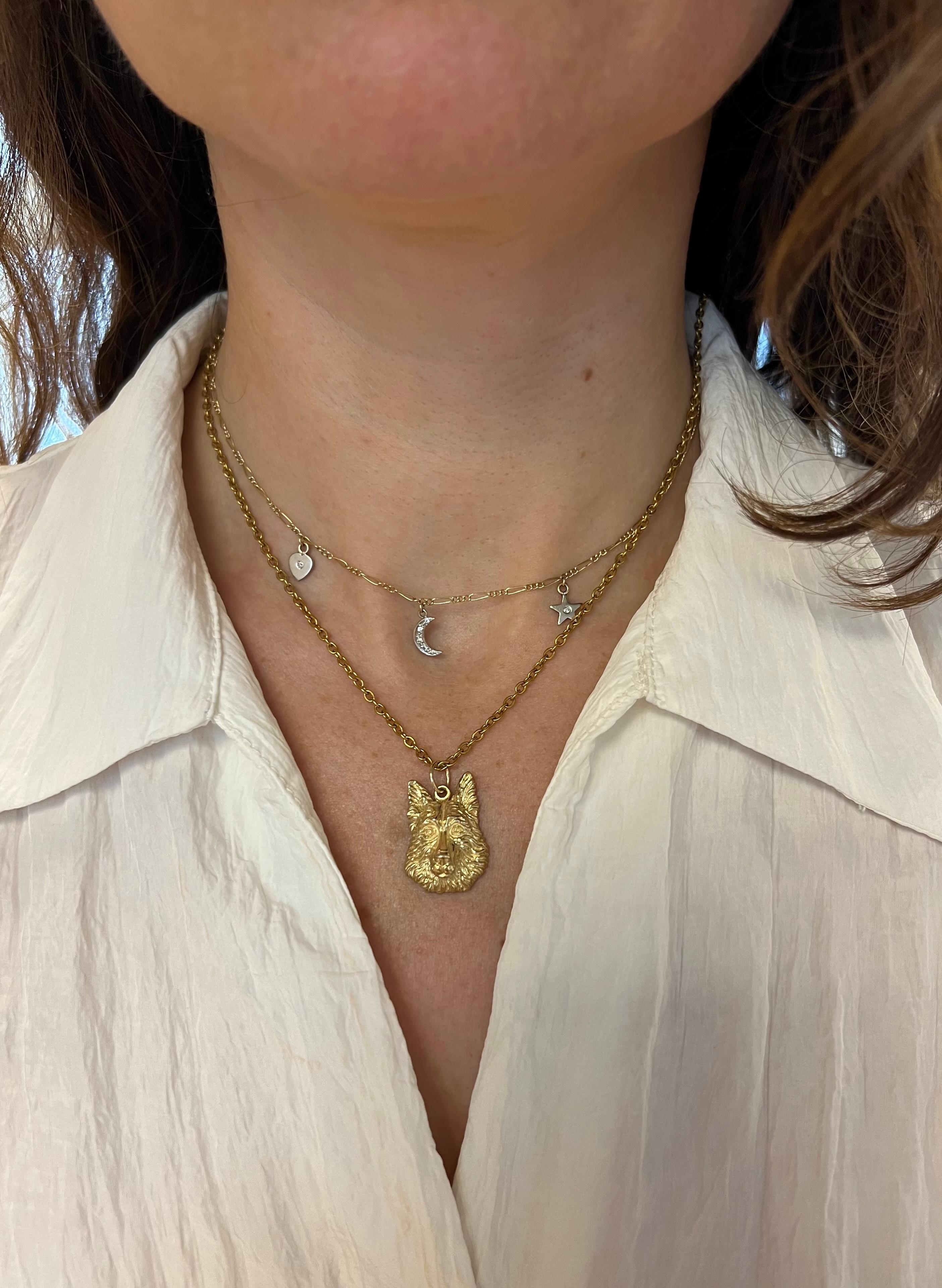 This exquisite pendant, crafted from 14k yellow gold, beautifully showcases the noble and loyal German Shepherd. Featuring intricately detailed head of the beloved breed, this pendant captures the essence and character of the German Shepherd with
