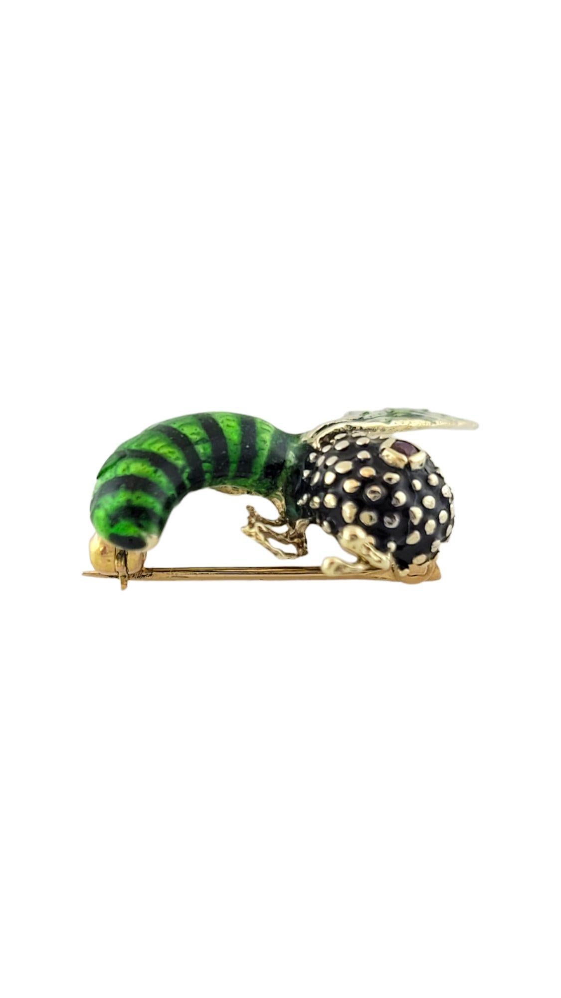 Vintage 14K Yellow Gold Green and Black Enamel Wasp Pin

This 14K yellow gold wasp pin is decorated with green and black enamel as well as a red cabochon stone to represent an eye!

Size: 25.1mm X 20mm X 6.8mm

Weight: 4.5 g/ 2.9 dwt

Hallmark: