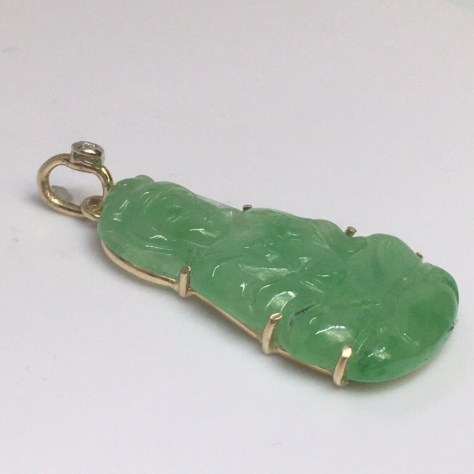 14K Yellow Gold Jadeite Jade Sitting Buddha Charm Diamond Pendant   

Hangs: 1.75 inch
Weight: 8.2 Gram 
Condition: No chips, no damage, in excellent preowned condition 

American made Quality Workmanship 
