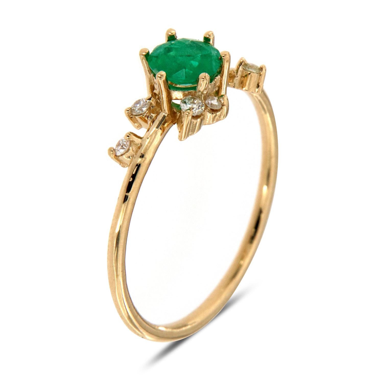 This petite handcrafted earthy, organically designed ring features a Round 0.31 - Carat  Natural Rustic Colobian Green Emerald . Six (6) round diamonds are un evenly scattered on a 1.2 mm wide shank adds to its rustic style. Experience the