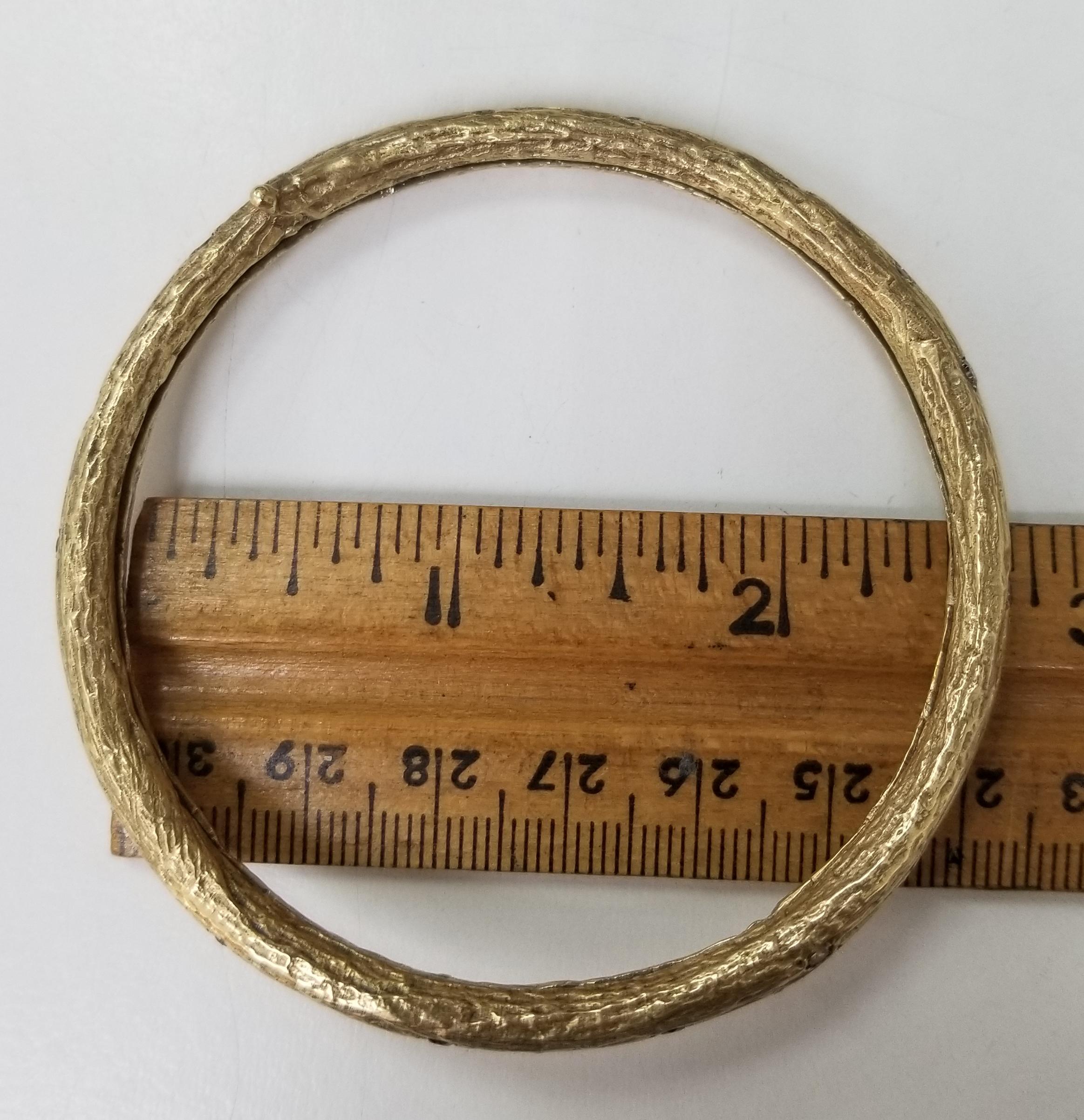 14k yellow gold Gresha signature bark bangle with 31 round natural; white, yellow and brown diamonds weighing 2.50cts.  The bangle is 2 1/2 inches in diameter on the inside, it could be made to fit (price will adjust)
*this design is ours and can be