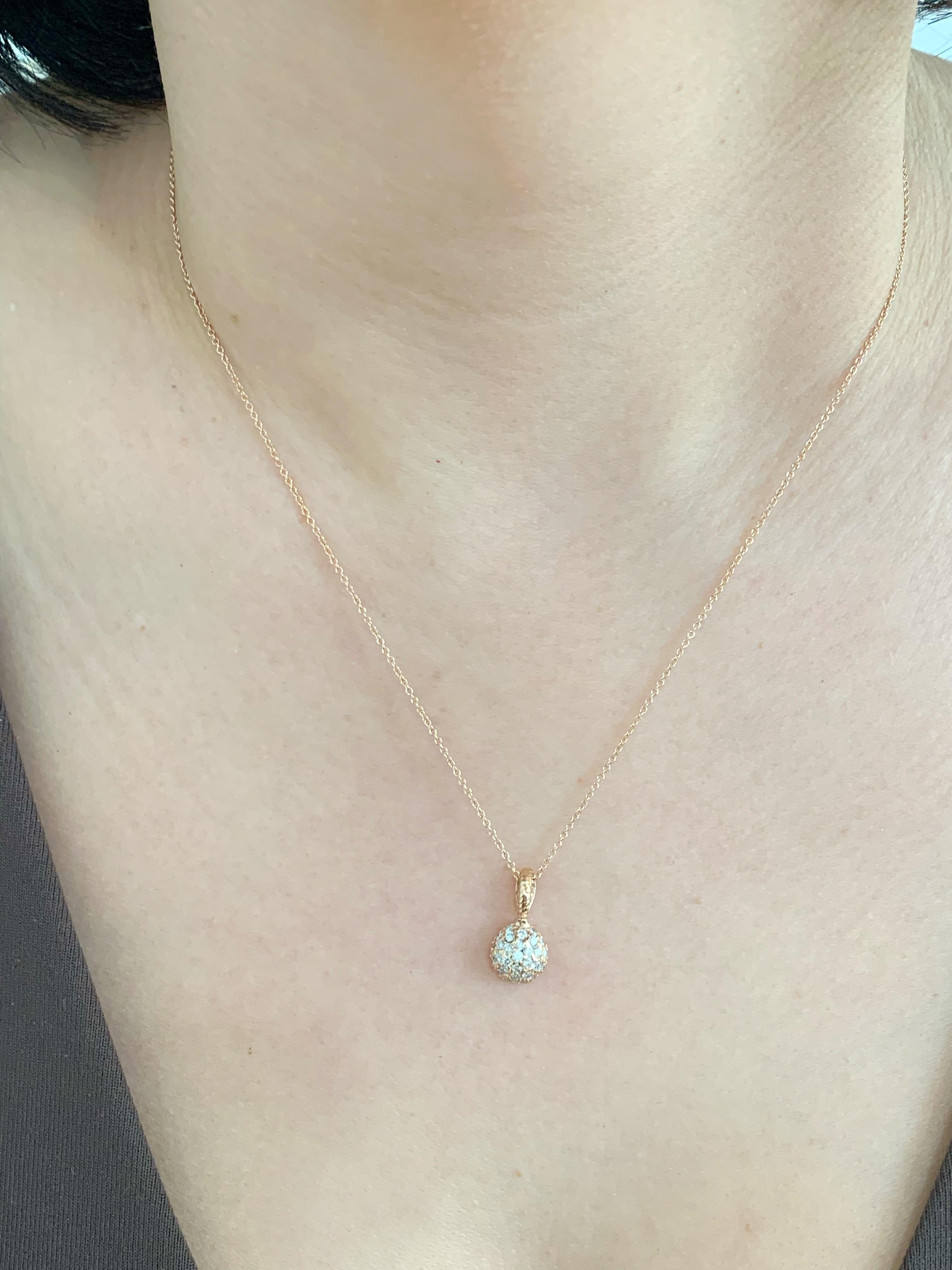 Crafted in 14K gold this pave pendant is an effortless piece to elevate your everyday look. Sitting under the collarbone, this pendant features glistening round diamonds set in a pave design. Stunning on its own and the perfect piece for