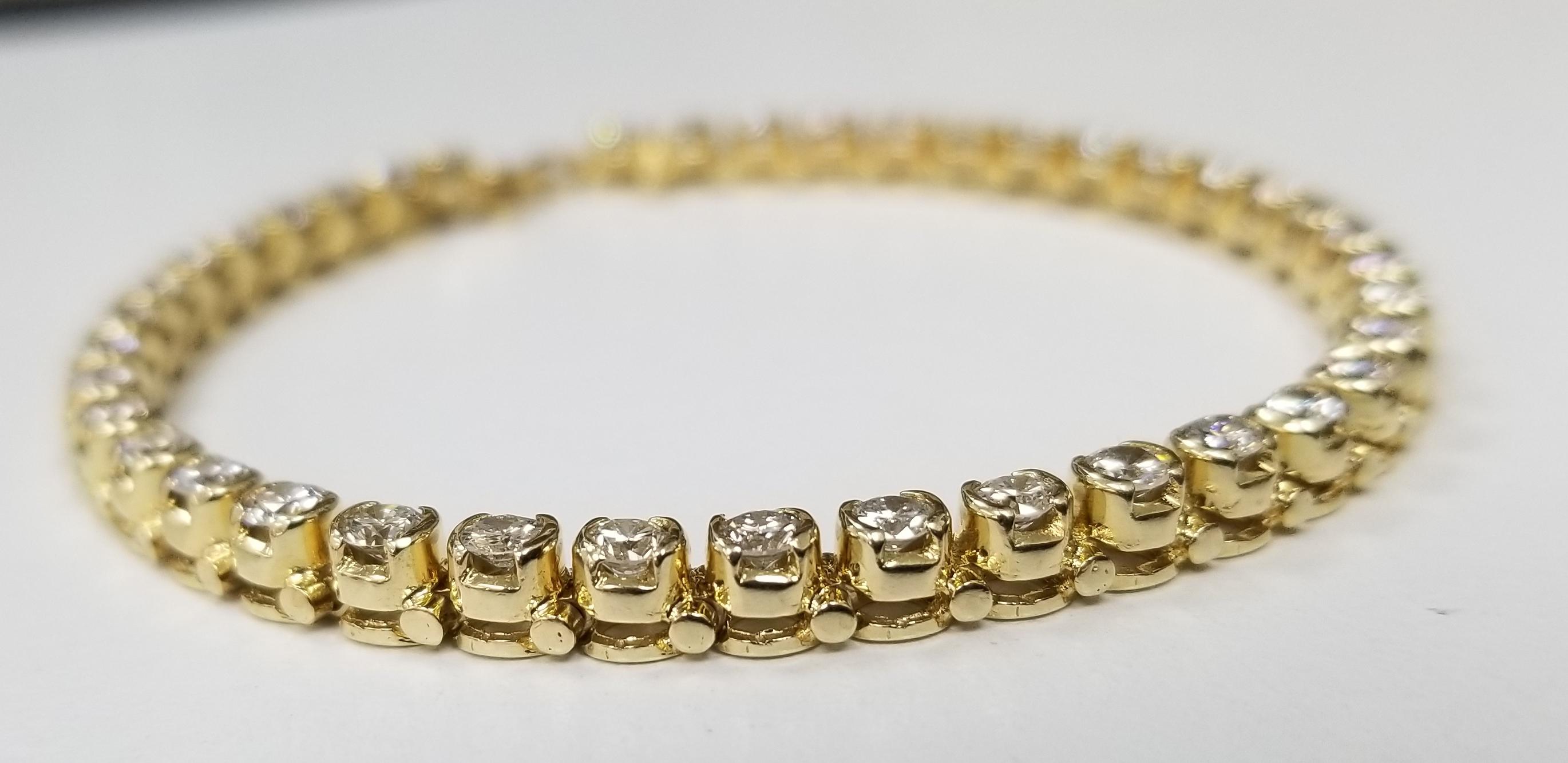 This is very beautiful 14k yellow gold custom made bracelet with very clean round diamonds. This bracelet has 40 pieces of stones in approximately 5.00 carat total weight, G color and VS1 in clarity..
Specifications:
    main stone: 40 PCS ROUND