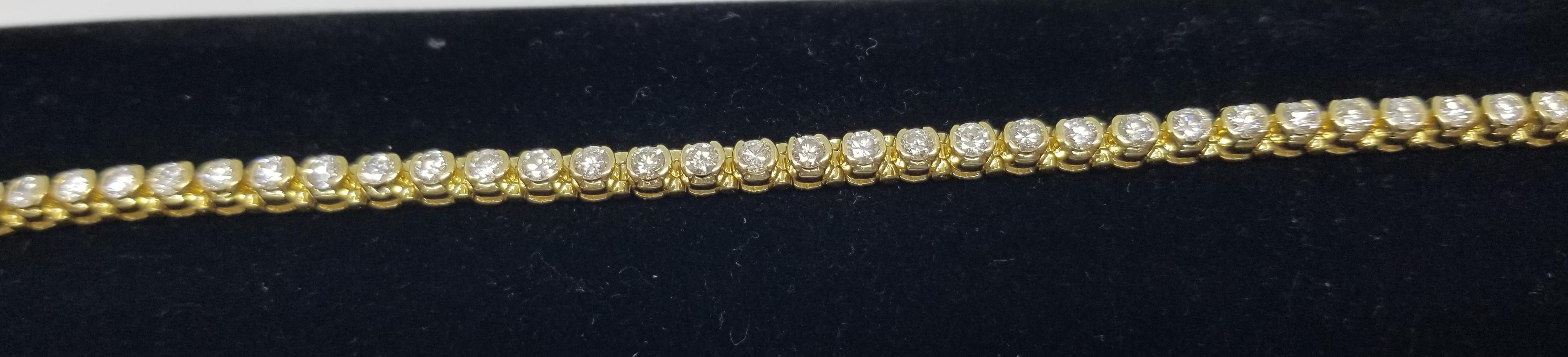 Women's or Men's 14 Karat Yellow Gold Half Bezel Set Diamond Tennis Bracelet Weighing 5.00 Carat