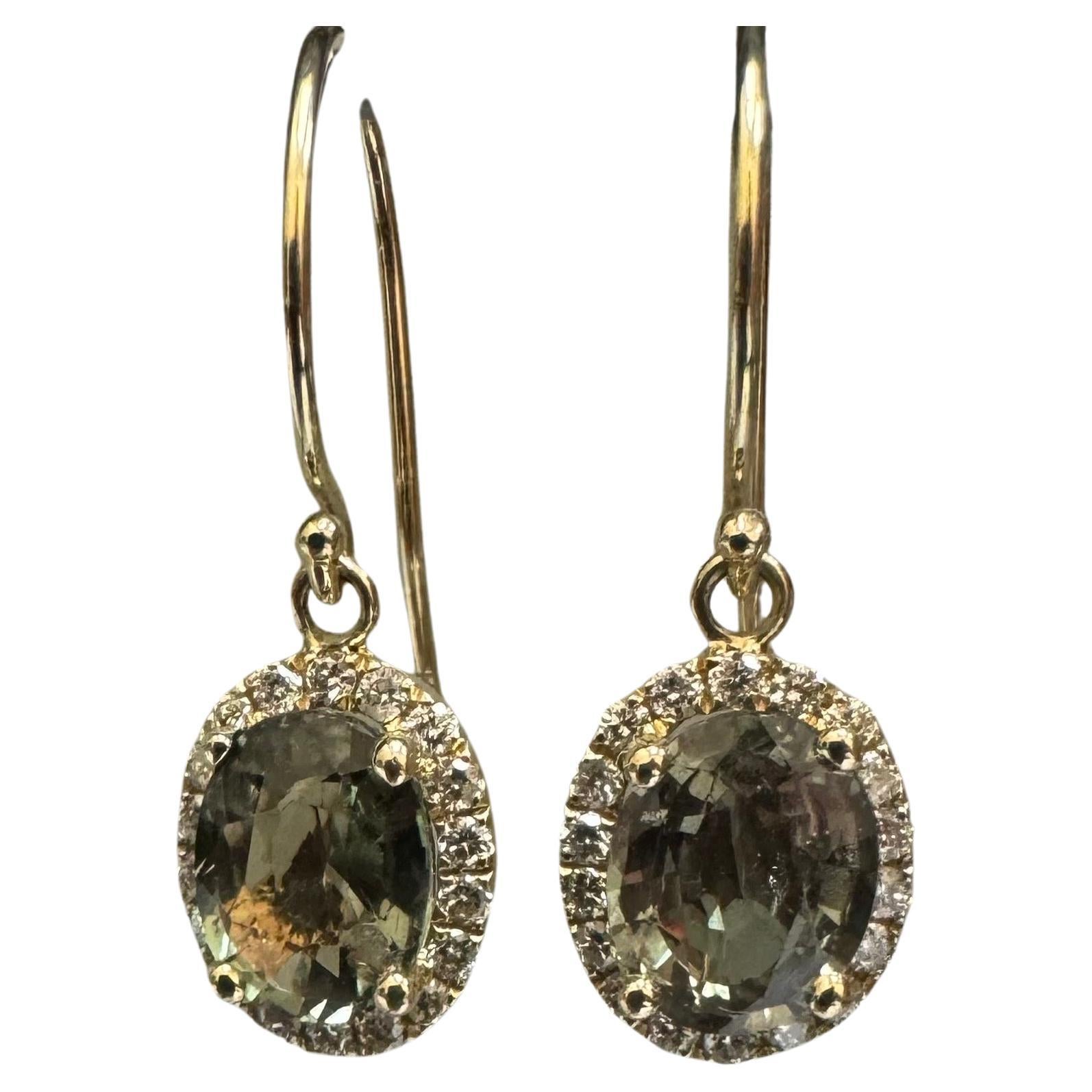 DeKara Designs Collection 

One of a Kind Matching Alexandrite Halo Diamond Earrings.

Metal- 14K Yellow Gold, .583.

GIA Report Number 5234326889

Stones- Two Oval Matching Alexandrites 3.00 Carats, 36 Round Diamonds G-H Color VS2 Clarity 0.36