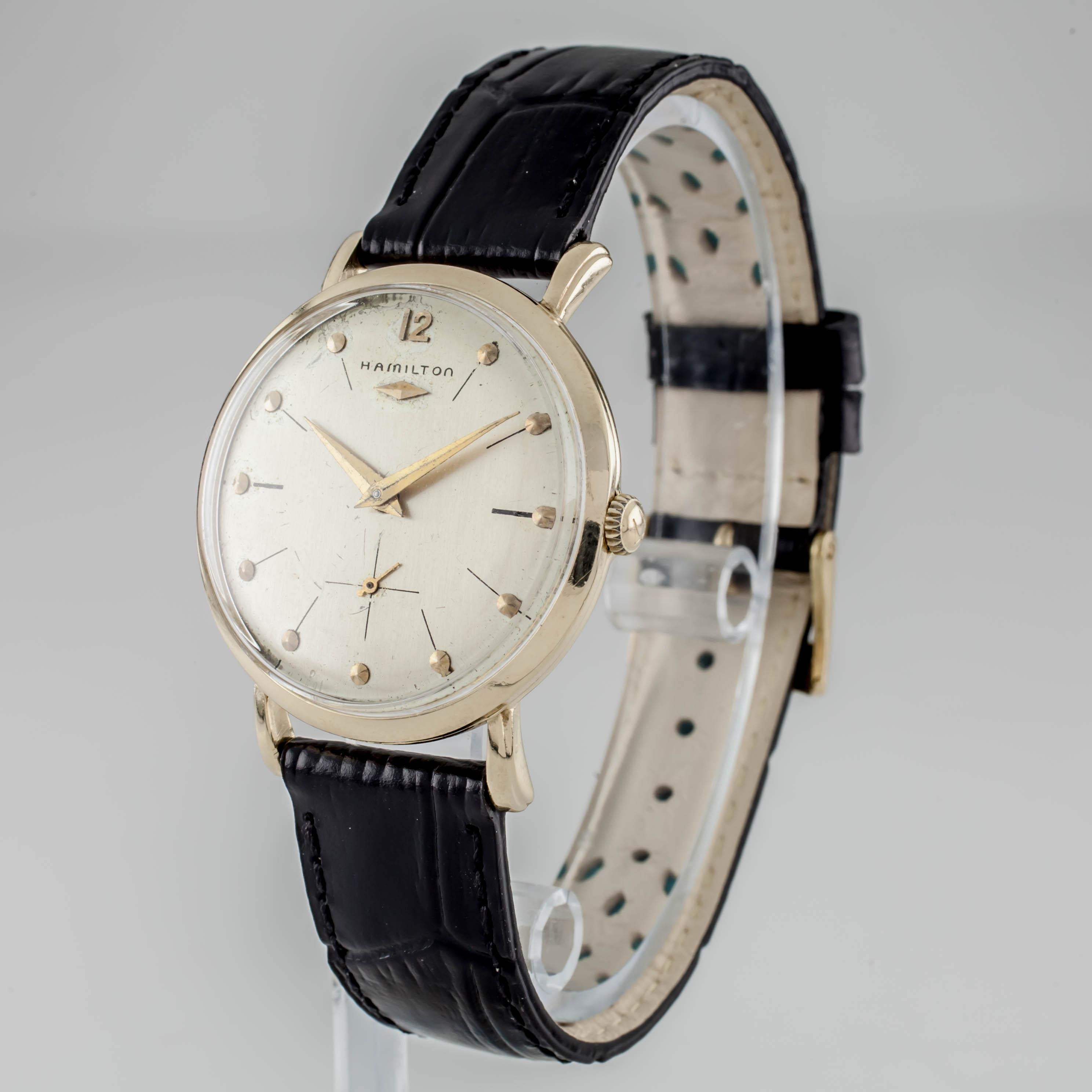 14k Yellow Gold Hamilton Men's Hand-Winding Watch w/ Black Leather Band
Movement #770 (22 Jewels)
Case #B31672

14k Yellow Gold Case
31 mm in Diameter (33 mm w/ Crown)
Lug-to-Lug Distance = 39 mm
Lug-to-Lug Width = 16 mm

Champagne Dial w/ Gold Tic