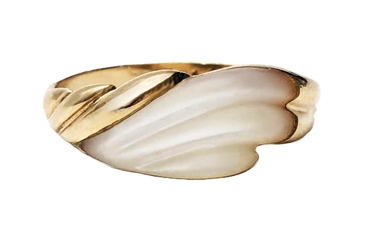 This is a unique diamond ring.  It has a hand carved Art Deco Mother of Pearl stone that was fitted perfectly to this 14k Yellow Gold Band.  It's just a very cool design. 
 One-of-a-king for certian.  The ring is stamped with a copyright 