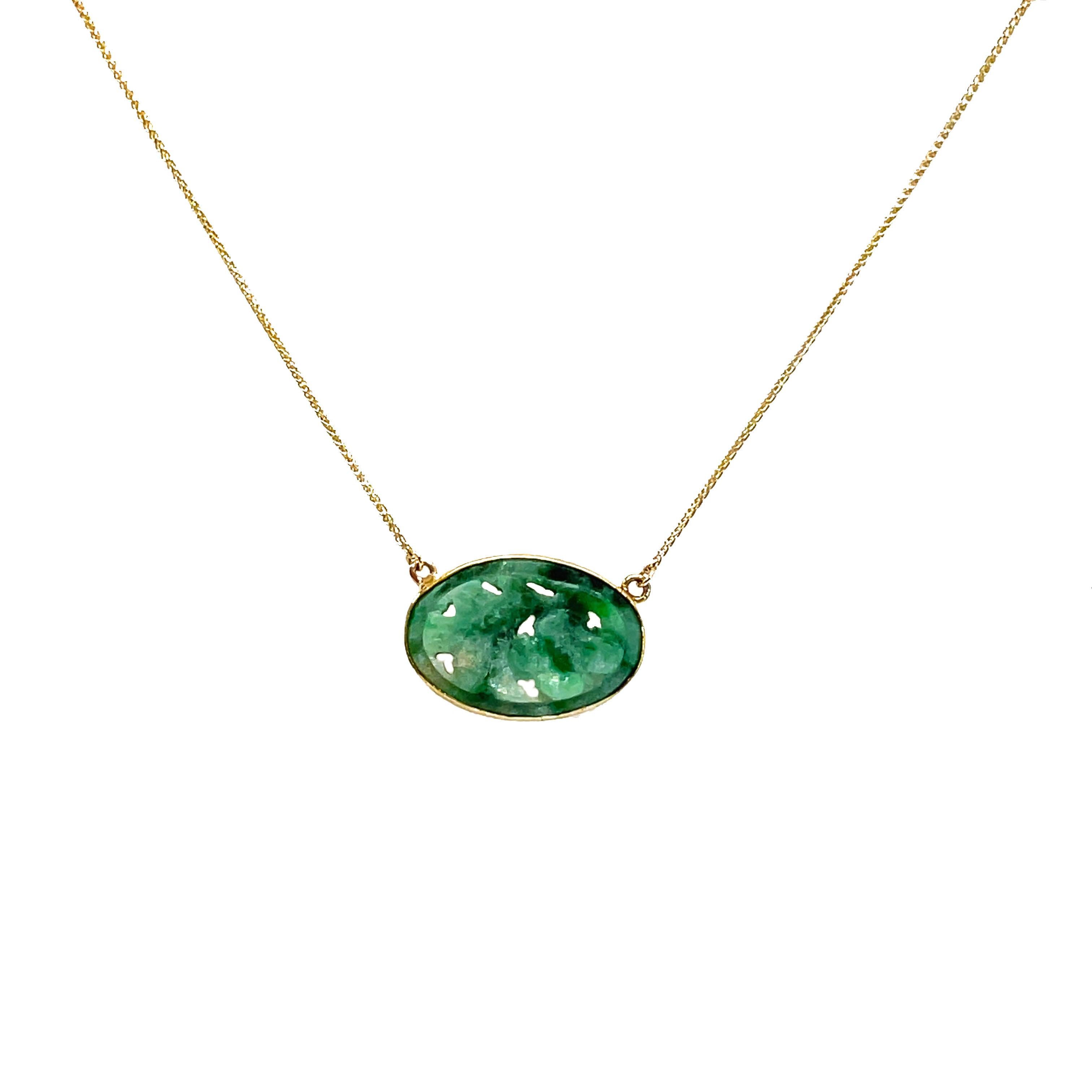 This is an absolutely beautiful necklace set in 14K yellow gold with a bezel set jade nephrite that has been hand-carved into a flower pattern! This necklace carries so much beauty in its's simplistic design. The warm golden bezel complements the