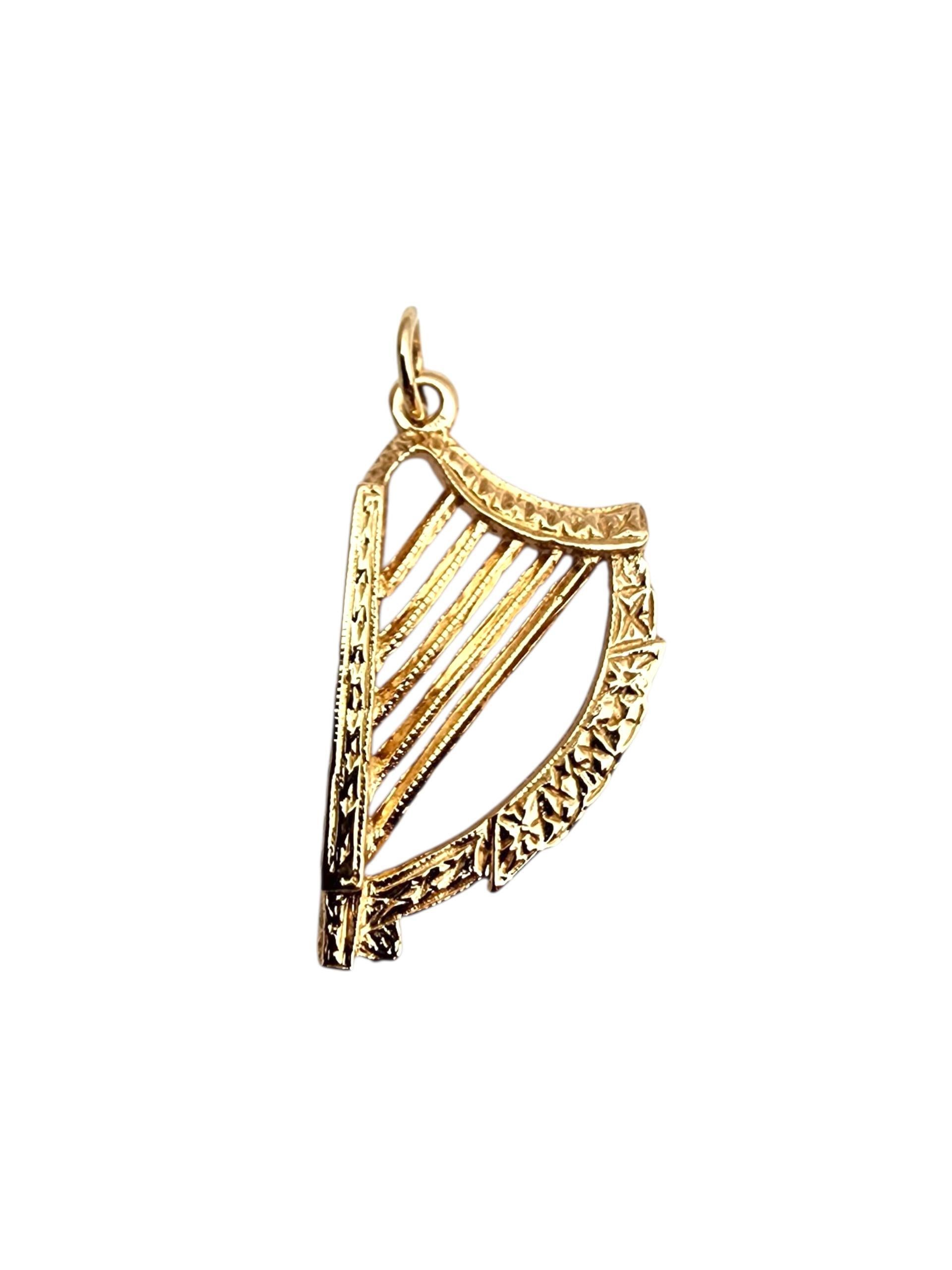 14K Yellow Gold Harp Pendant-

14K yellow gold harp pendant featuring elegant, detailed design—graceful and timeless.

Size with bail: 30.2 mm x 15.4 mm x 8.8 mm

Size without bail: 27mm 

Weight: 4.8 gr./ 3.1 dwt.

Stamped: 14 585

Very good