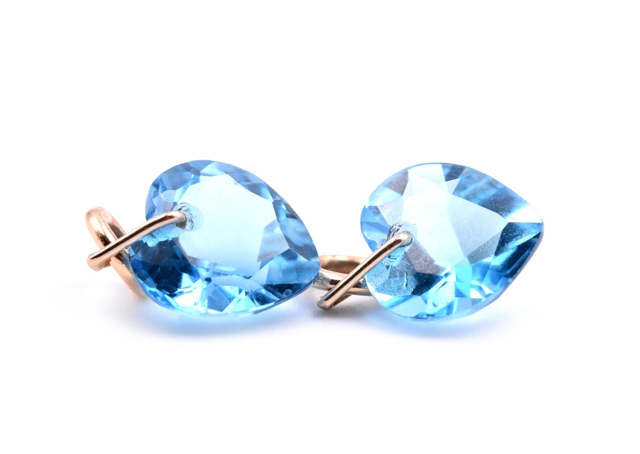 Designer: custom design
Material: 14k yellow gold
Topaz: 2 heart cut blue topaz
Dimensions: earring charms measure 10mm x 9.65mm
Fastenings: earring enhancers
Weight: 2.07 grams
