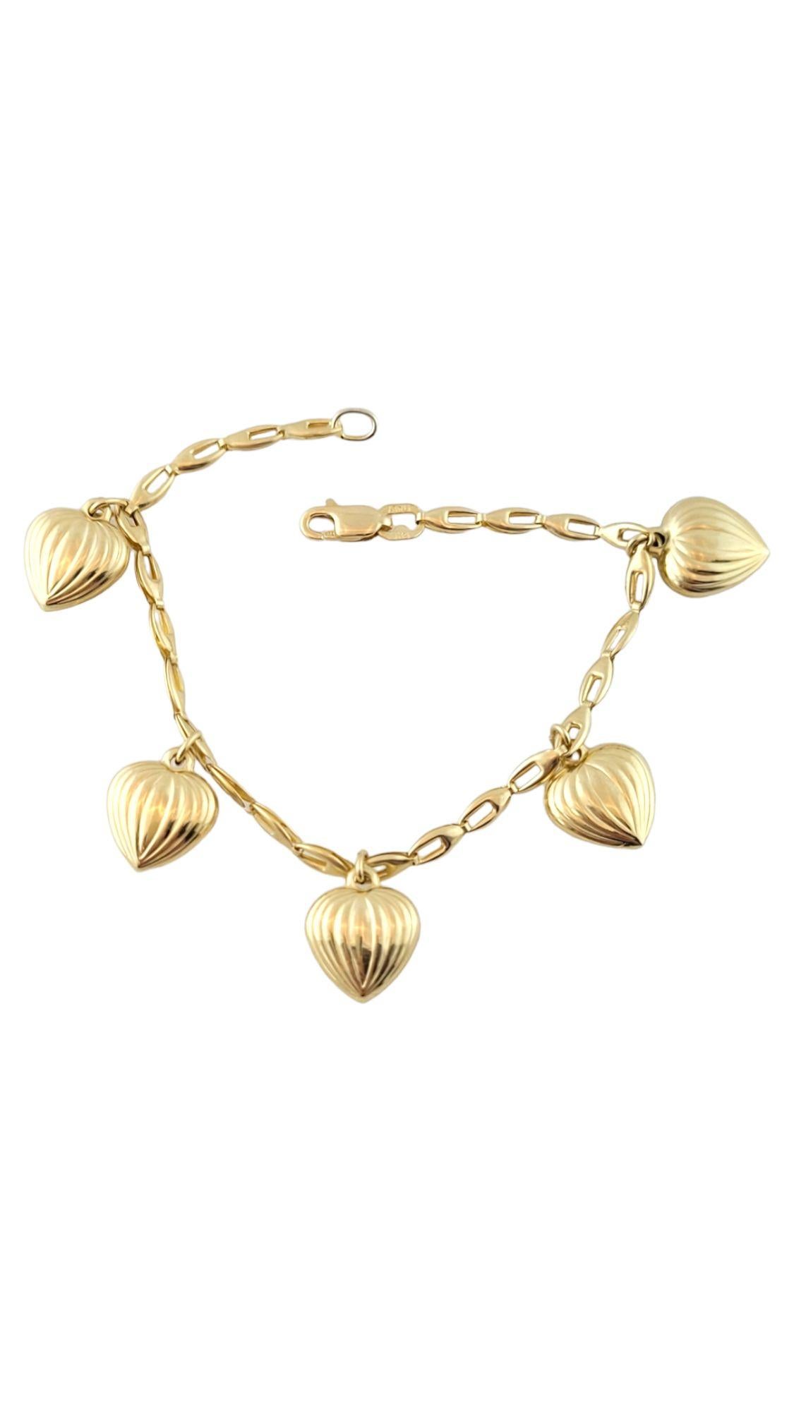 This beautiful 14K gold charm bracelet is decorated with 5 adorable heart charms!

Bracelet size: 61/4