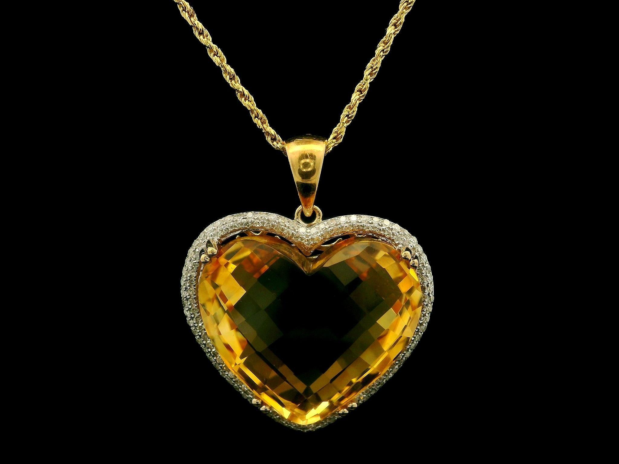 --Stone(s):--
(1) Natural Genuine Citrine - Checkerboard Heart Cut - Prong Set - Vivid Orange Color - 19.9x21.6mm (approx.)
Numerous Natural Genuine Diamonds - Round Brilliant Cut - Micro Pave Set - Nice Brilliant White Color - 0.35ctw