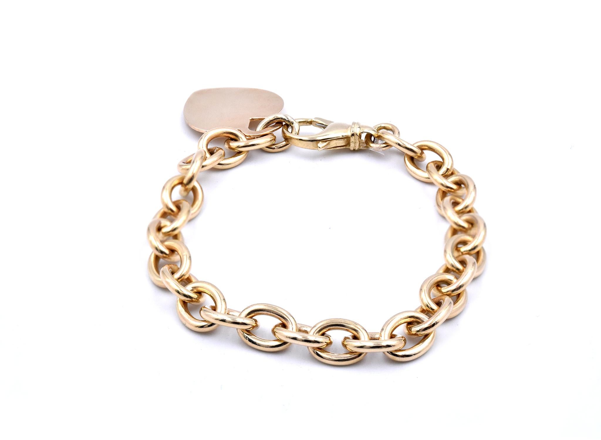 14 Karat Yellow Gold Heart ID Link Bracelet In Excellent Condition For Sale In Scottsdale, AZ