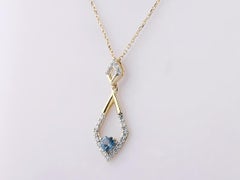 Halskette mit Anhänger aus 14-karätigem Gelbgold in Herzform mit London-Blue-Topas und Diamanten