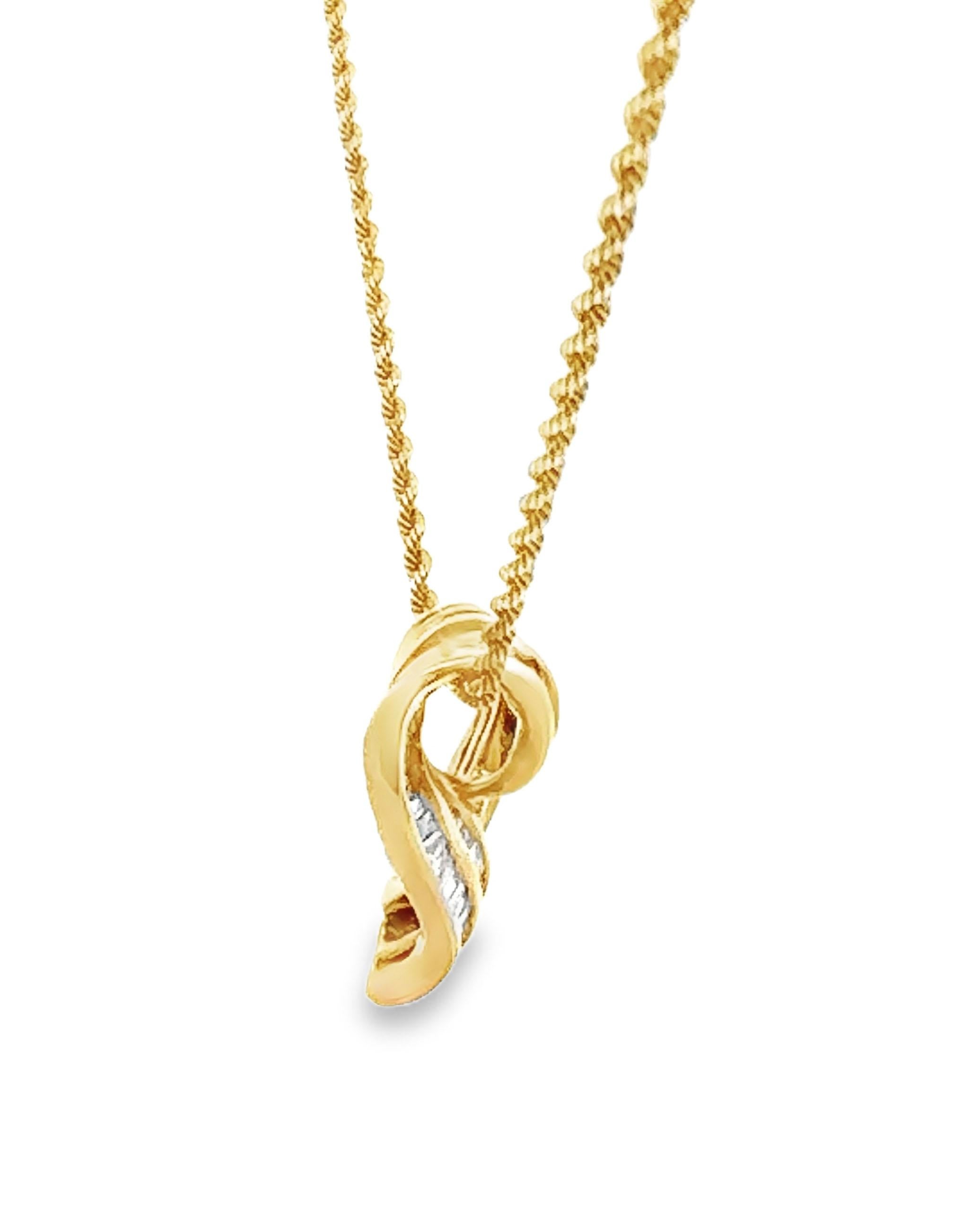 Pre-Owned 14K yellow gold heart pendant slide with channel set baguette diamonds weighing 1.25 carats total. Pendant slides on a 14K 16inch rope chain. 

*Baguette diamonds are G color, VS2/SI1 clarity