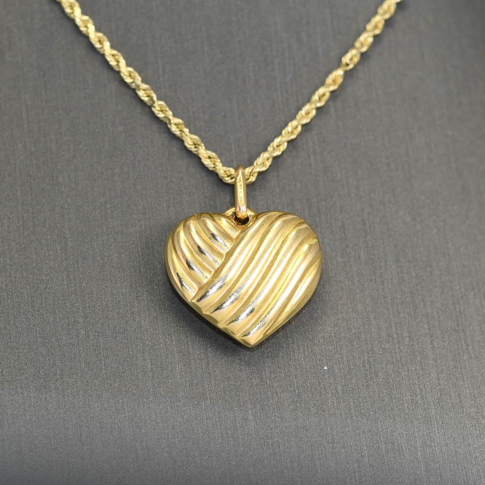 14k Yellow Gold Rope chain with 14k Heart Pendant.
Both stamped and tests 14k. 
The chain measures 20in long
total weight 10.9gr