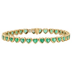 Herzförmiges Smaragd-Tennisarmband aus 14 Karat Gelbgold