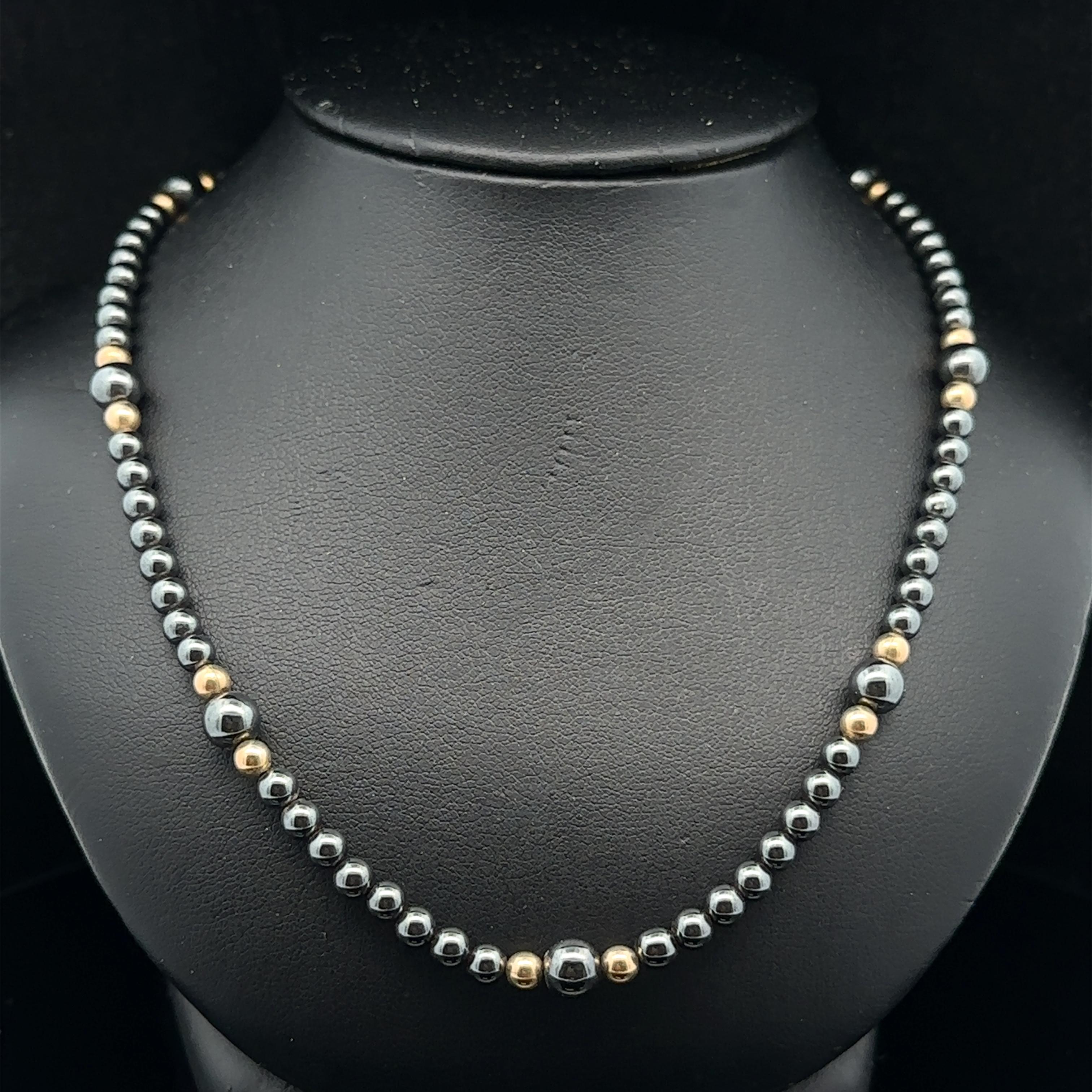 -- Stone(s) --
(Numerous) Natural Genuine Hematite - Round Bead Cut - Grey Color - 4.19mm and 5.76mm (approx.)

Material: Solid 14K Yellow Beads 
Clasp
Weight: 21.32 Grams (gross)
Length: 18