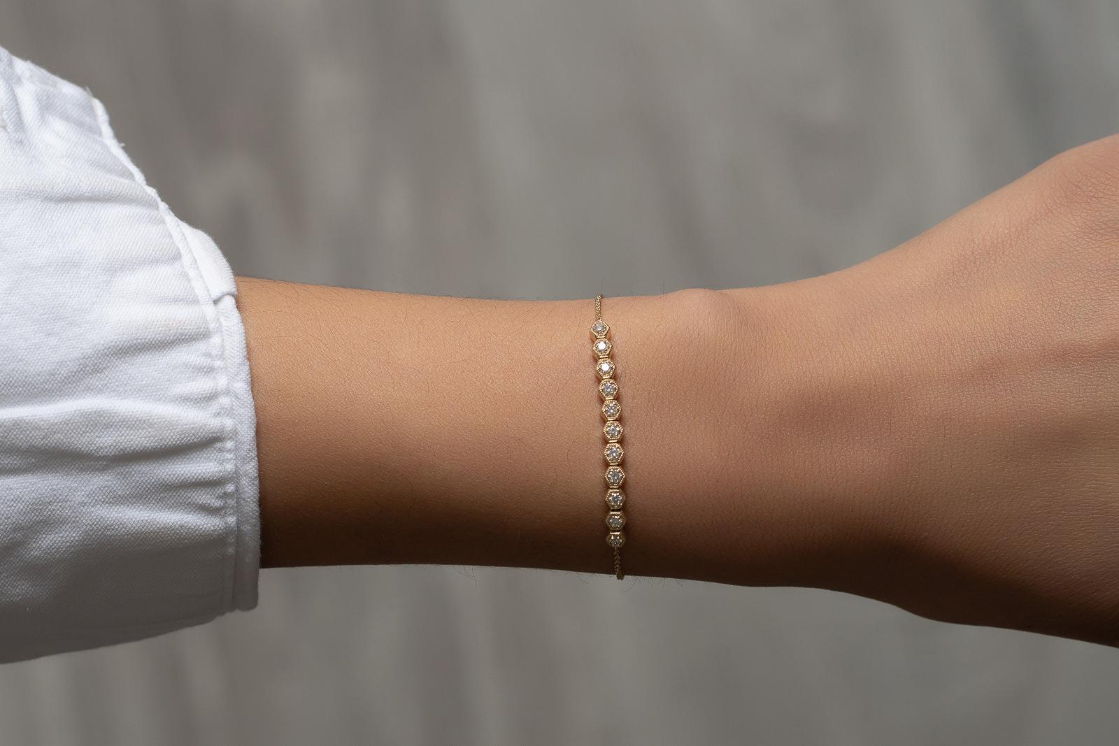 In trend with dainty and minimalistic jewelry, this romantic piece is the perfect stackable bracelet yet it's chic enough to wear as a standout. Layer your style with this 14k yellow gold bracelet featuring a honeycomb motif made of full cut