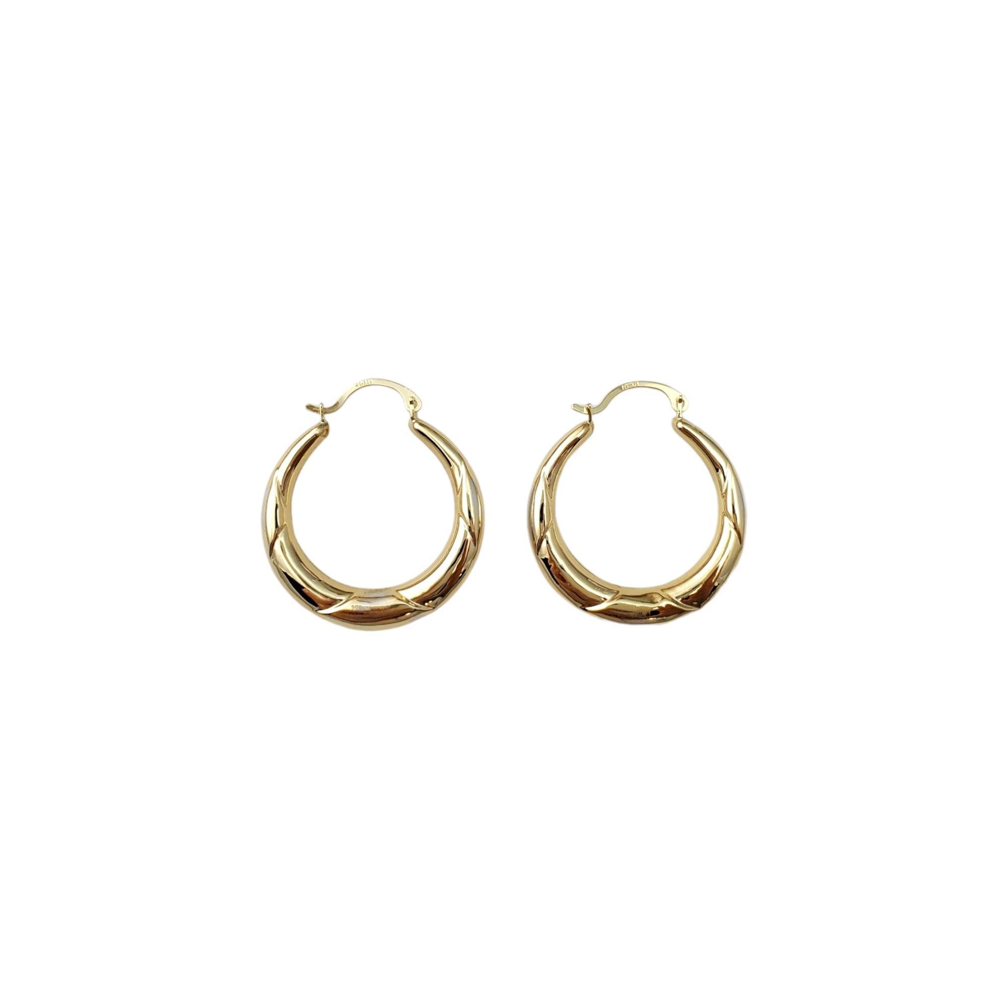 Vintage 14K Yellow Gold Hoop Earrings -

These classic hoop earrings are a stunning addition to your collection. Etched design on hoops

Size:  30.7 mm X 4.0mm x 4.3 mm

These earrings hang approx. 1 1/4