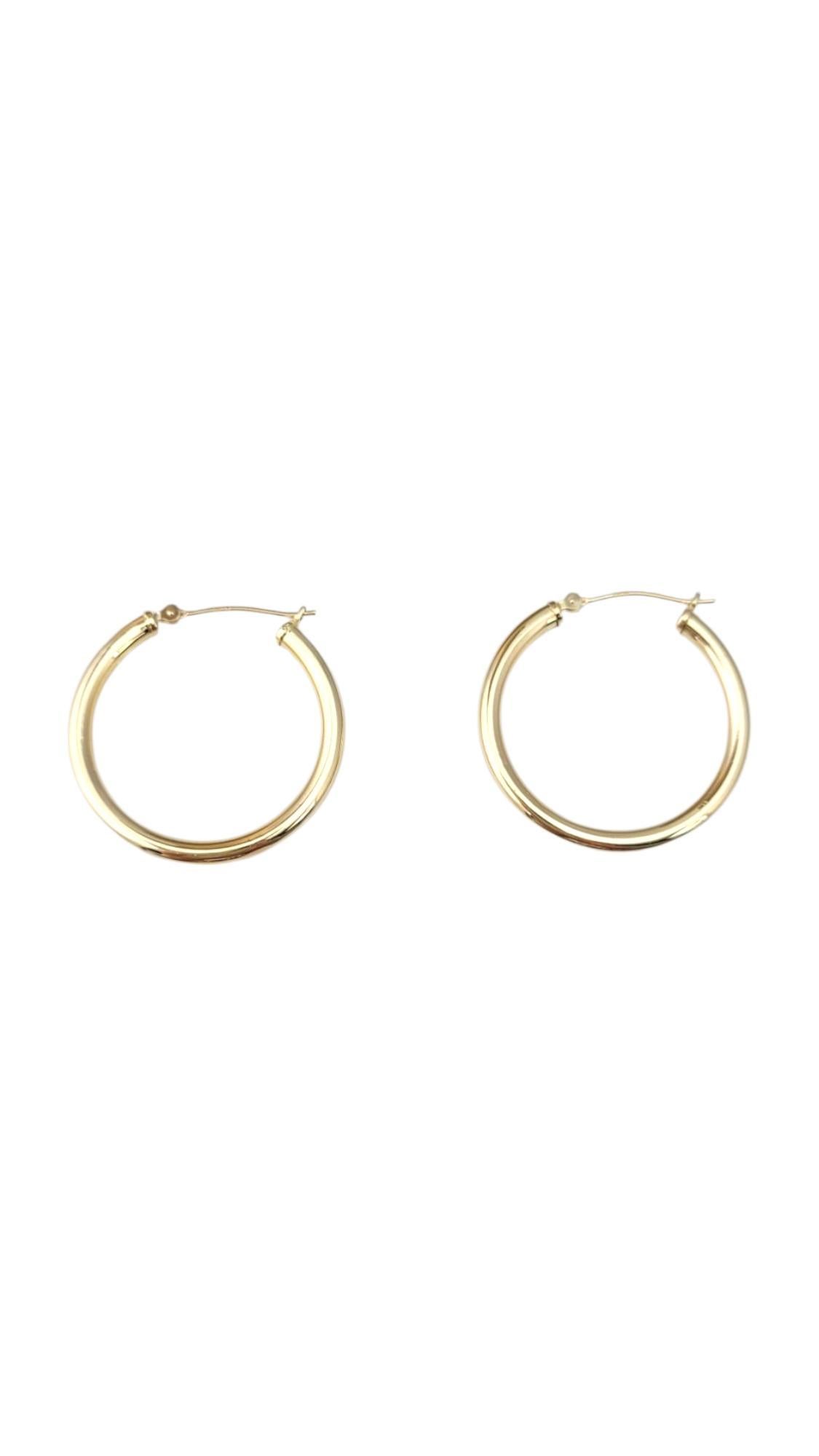 14K Yellow Gold Hoop Earrings -

These hoop earrings feature a classic, timeless design that effortlessly complements any outfit. With their sleek, polished finish and versatile style, they’re perfect for everyday wear or dressing up for special