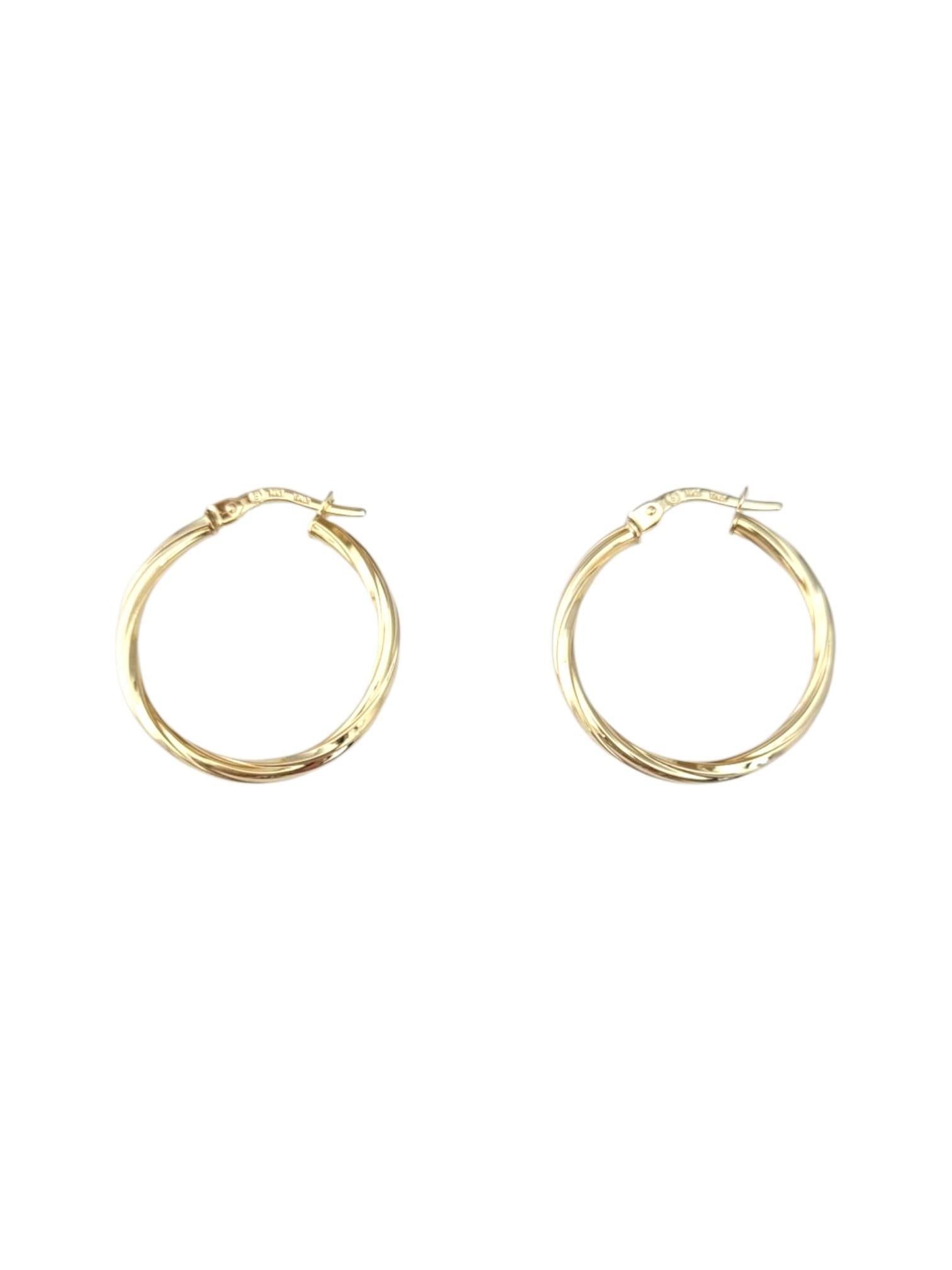 14K Yellow Gold Hoop Earrings -

These 14K yellow gold hoop earrings feature a classic, polished design that radiates warmth and elegance. Crafted from high-quality gold, they offer timeless style and everyday versatility—perfect for adding a touch