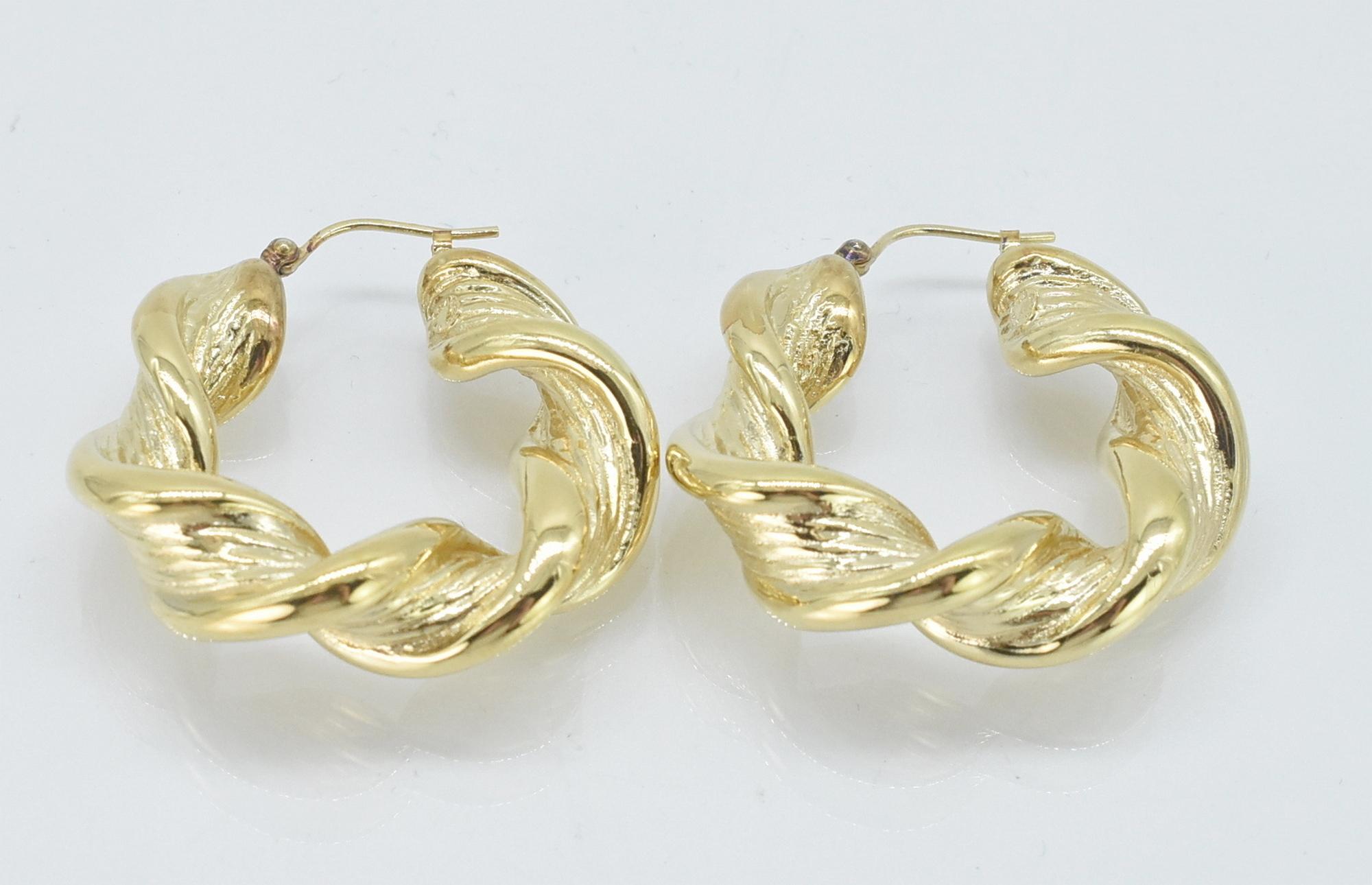 14K yellow gold hoop earrings. 14K yellow gold hoop earrings, twisted design. 1 3/8
